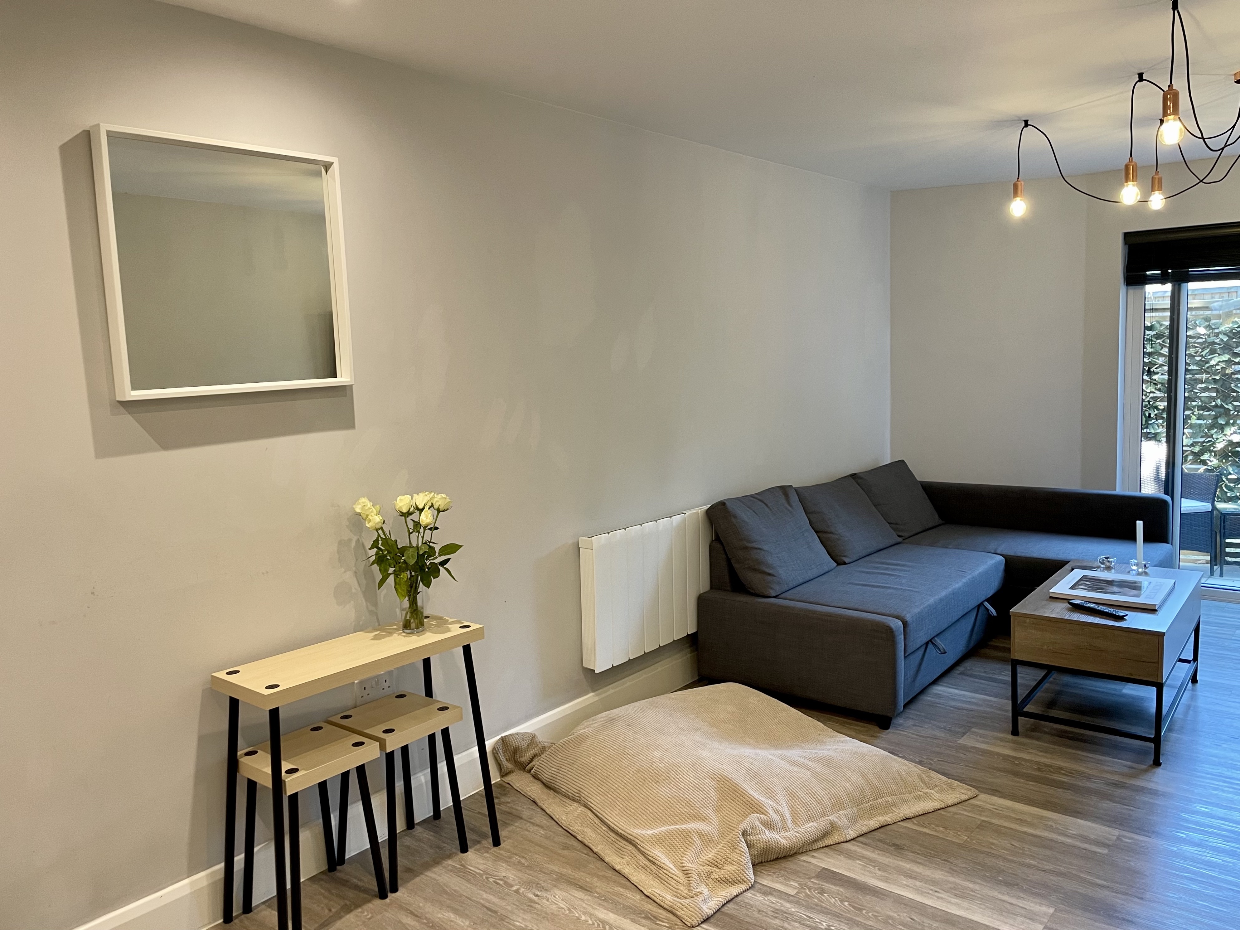 Modern minimalist meeting space in Immaculate Windsor Apartment for casual events.