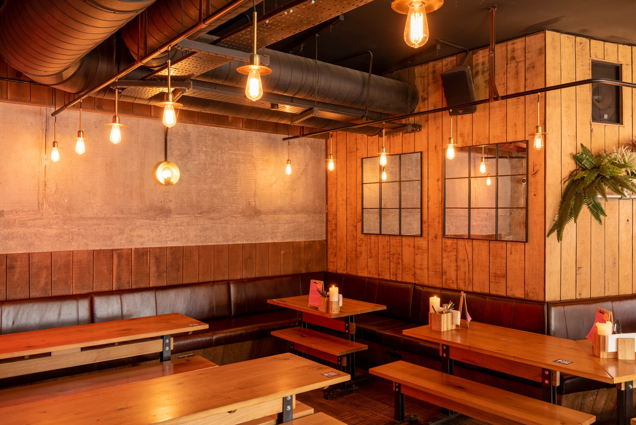 Cozy Cider Snug venue with warm lighting, ideal for networking and team-building events.