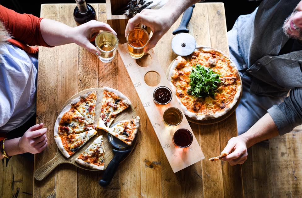 Cider Snug dining setup with wooden table for networking and team-building events.