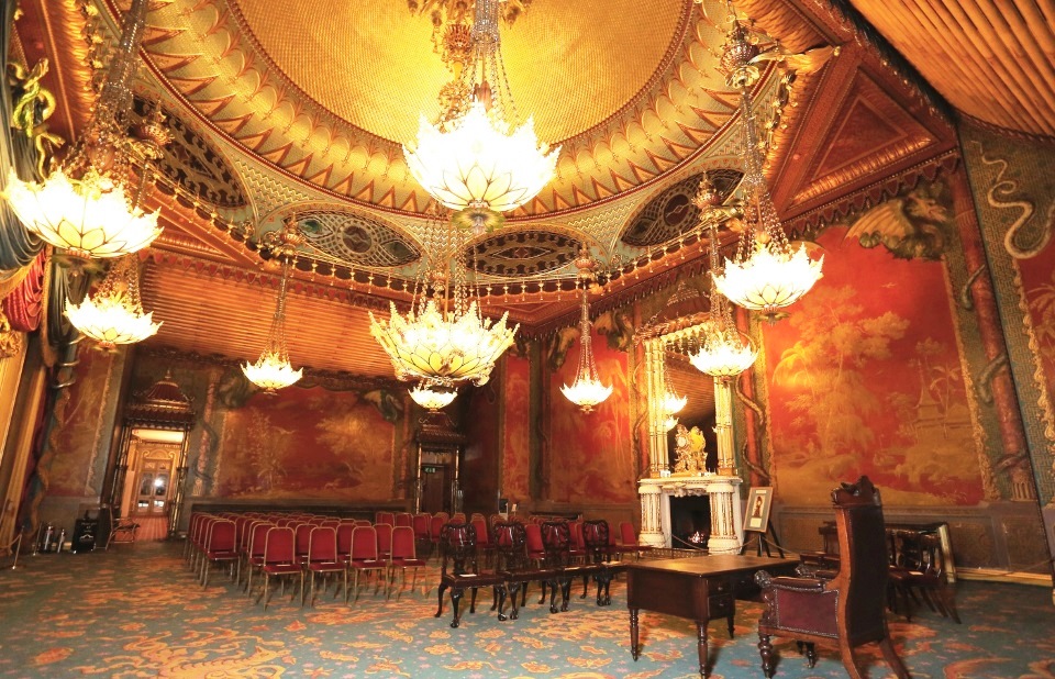 Opulent Music Room in Royal Pavilion with grand chandeliers, ideal for gala events.