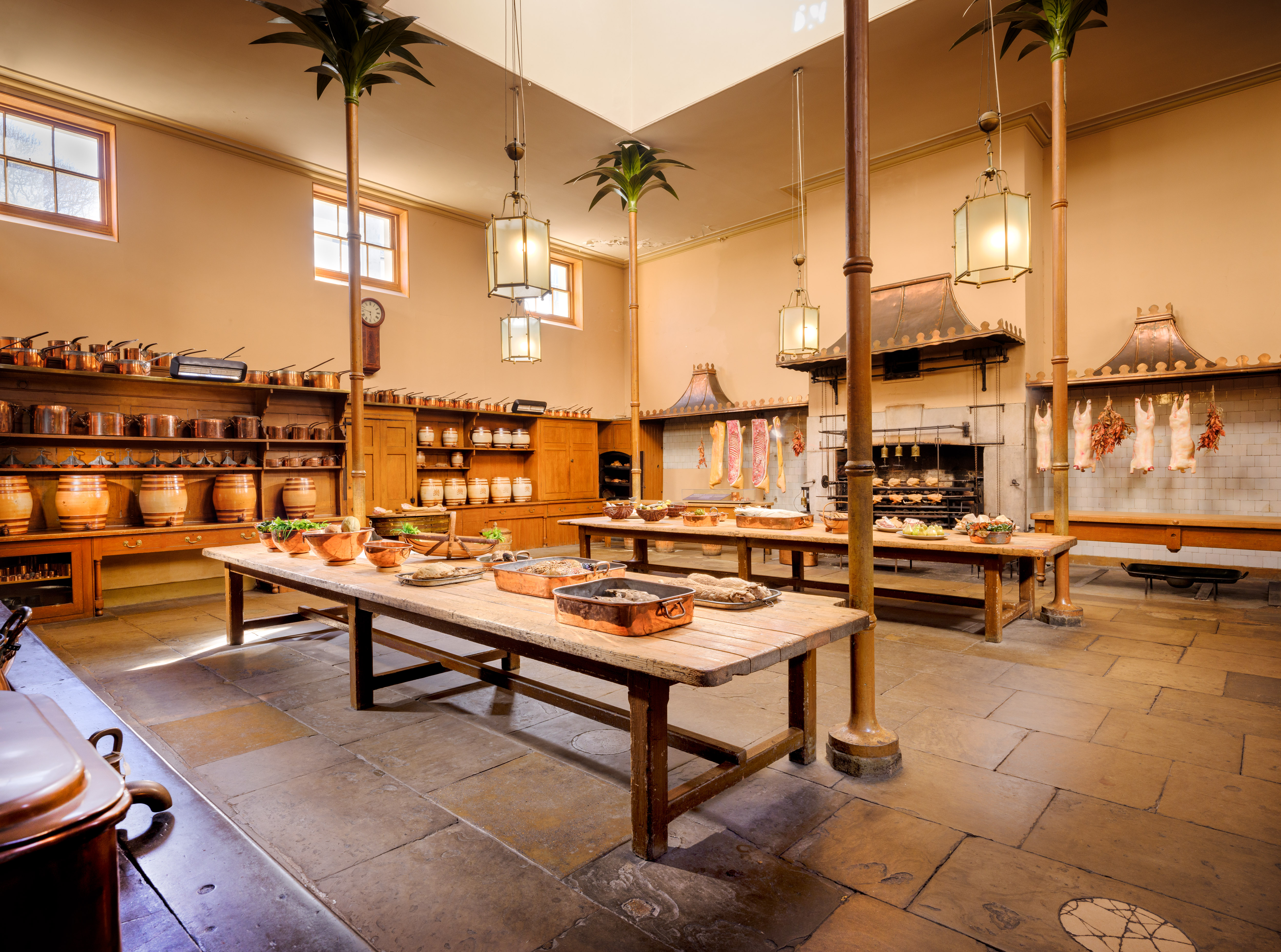 Great Kitchen in Royal Pavilion, rustic wooden tables, ideal for cooking classes and gourmet events.