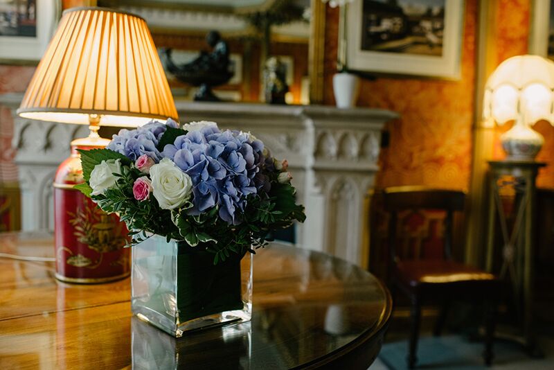 Elegant floral arrangement in Red Drawing Room, Royal Pavilion for events and gatherings.