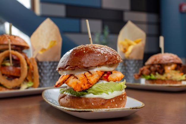 Gourmet burgers at Big Shots Golf UK, perfect for casual networking events.