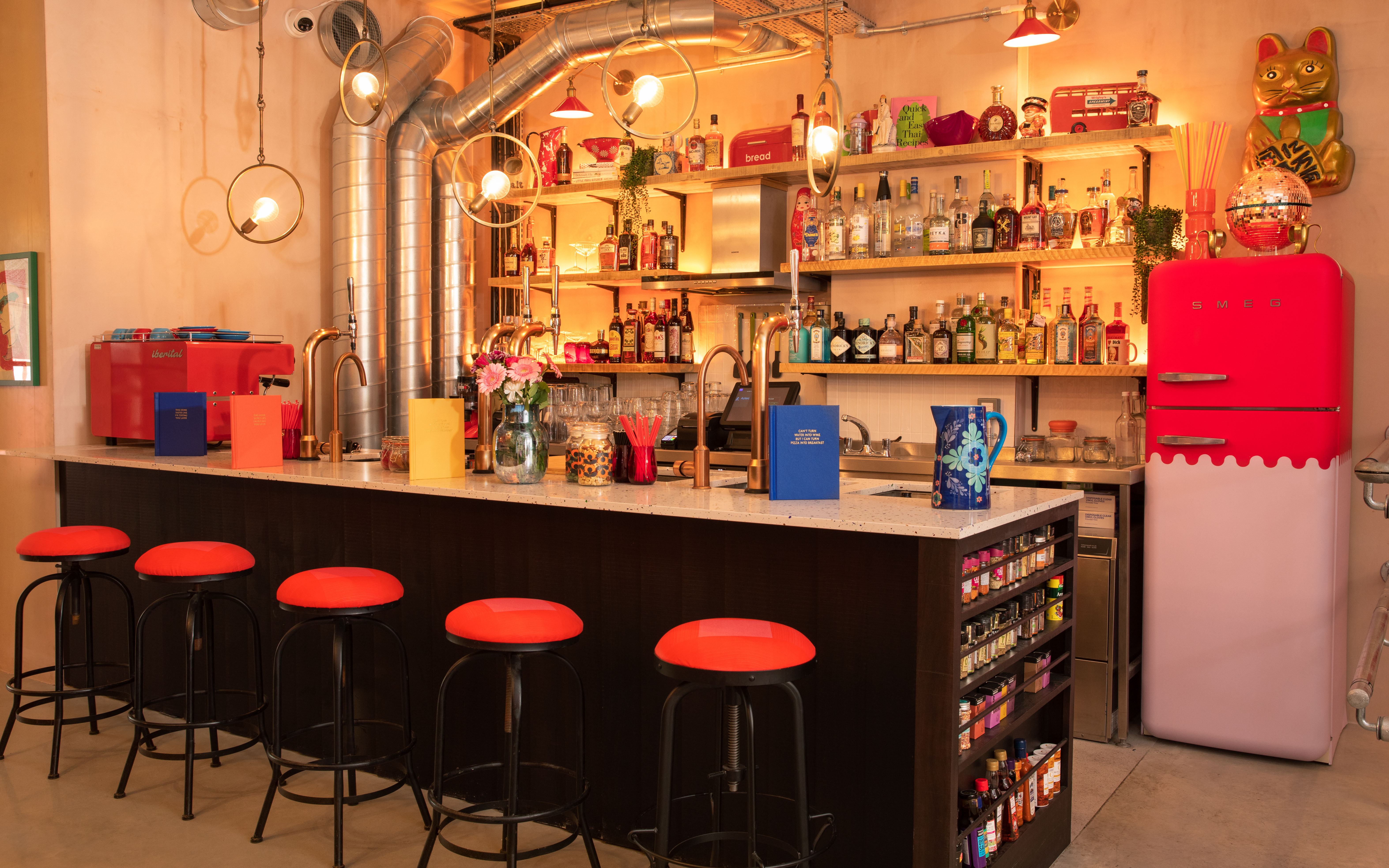 Vibrant bar setup at The Little Scarlet Door for networking events and gatherings.