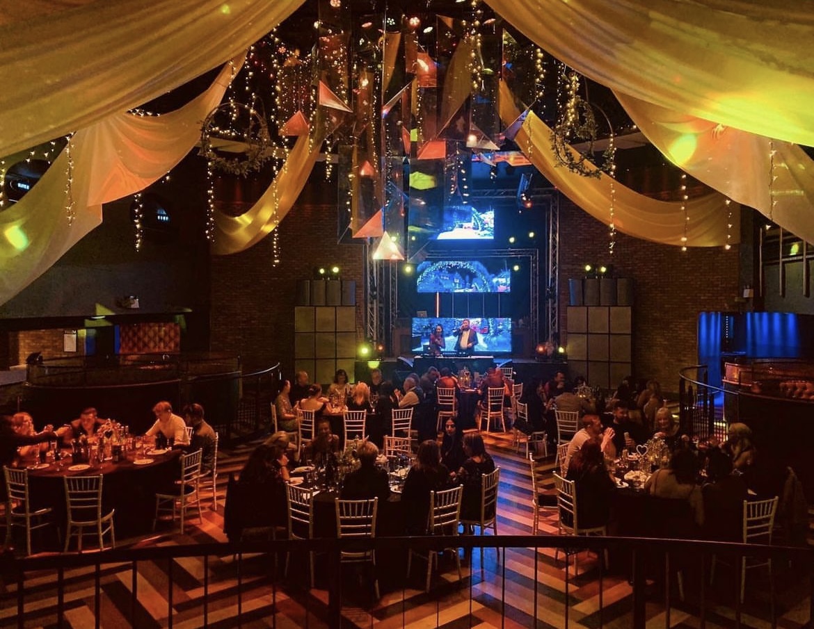 Pryzm Brighton Main Room set for a formal event with elegant tables and ambient lighting.