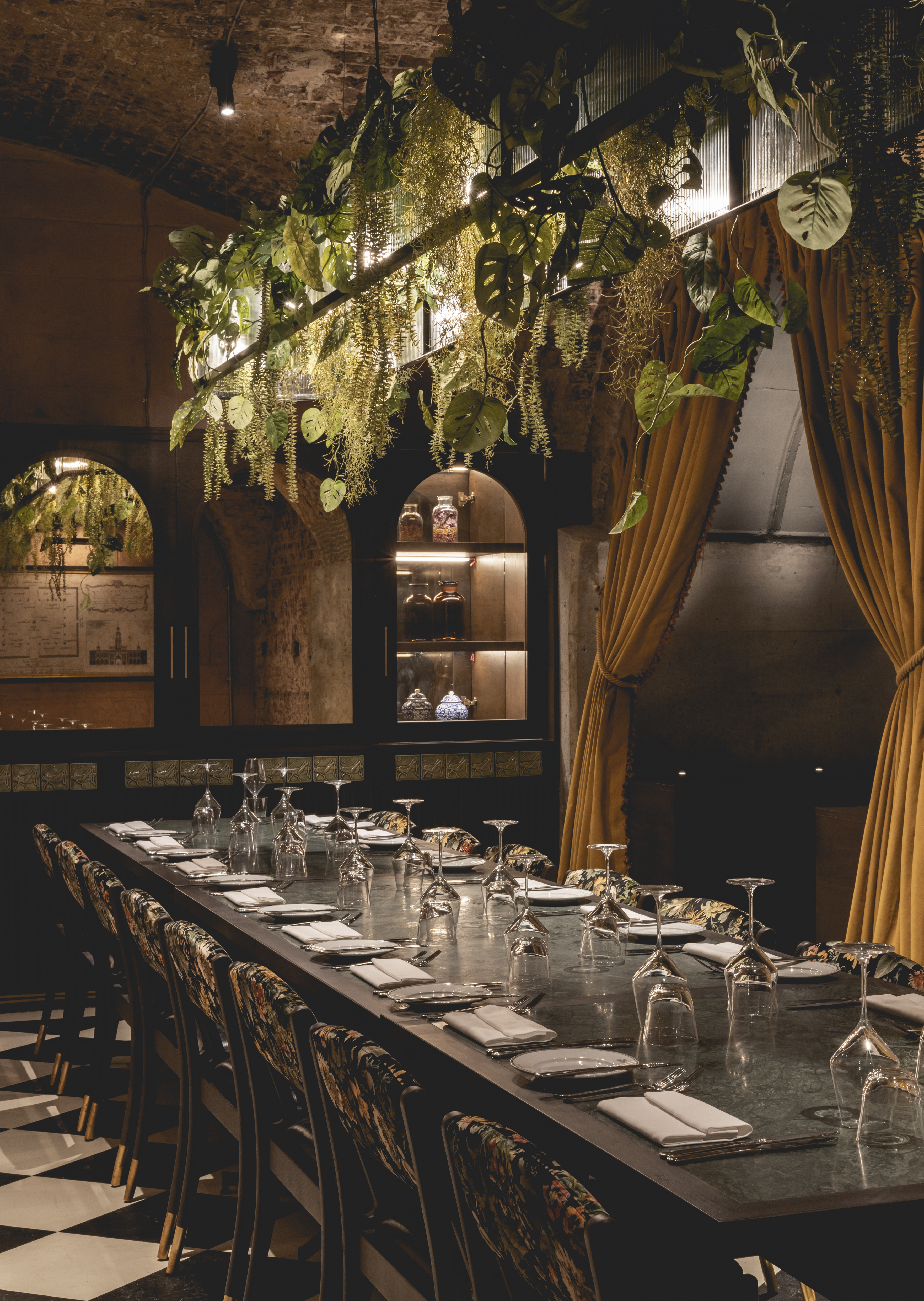 Elegant private dining room with lush greenery, perfect for intimate gatherings and corporate events.
