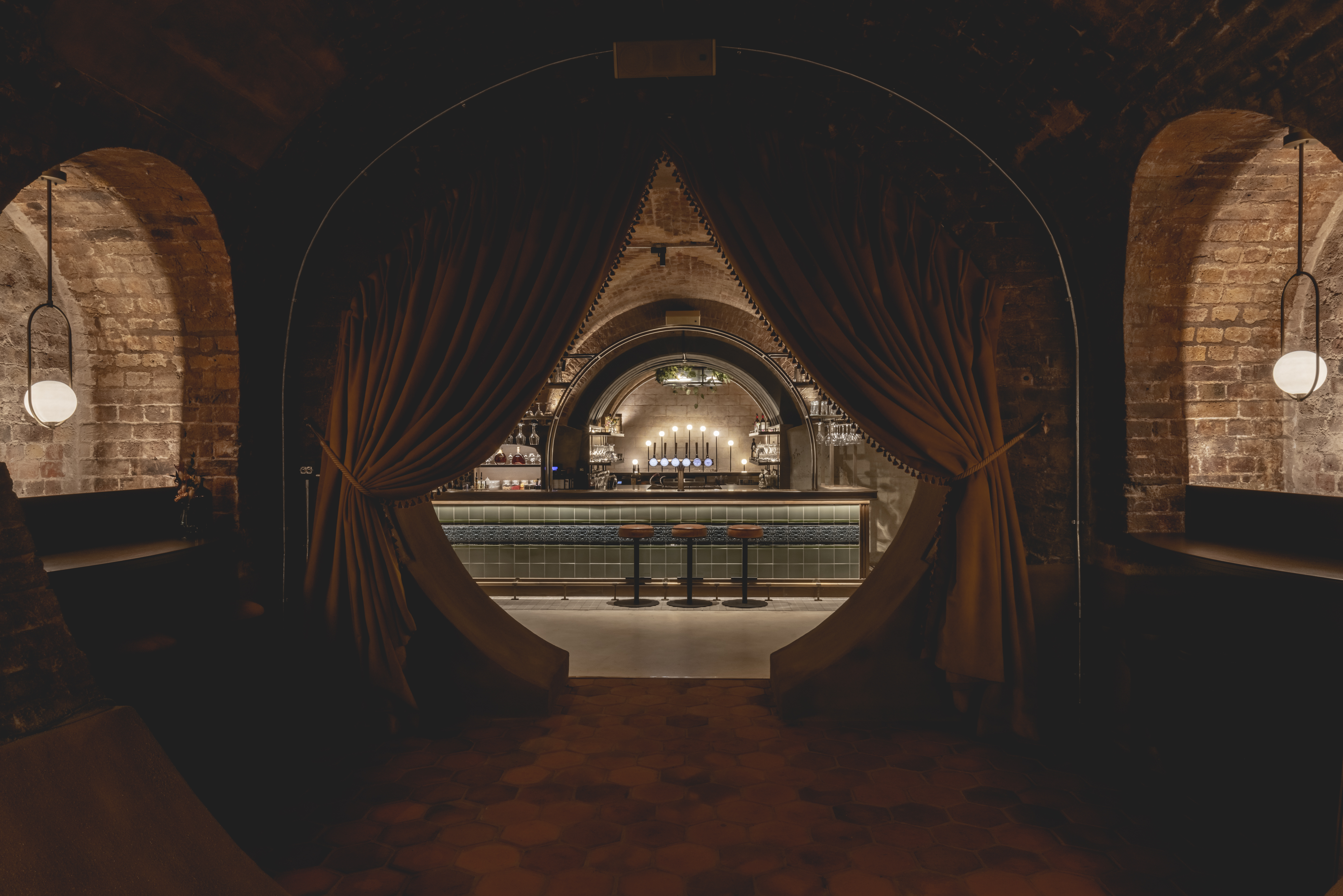 Whiskey Vault bar with arched entryways, perfect for cocktail receptions and gatherings.