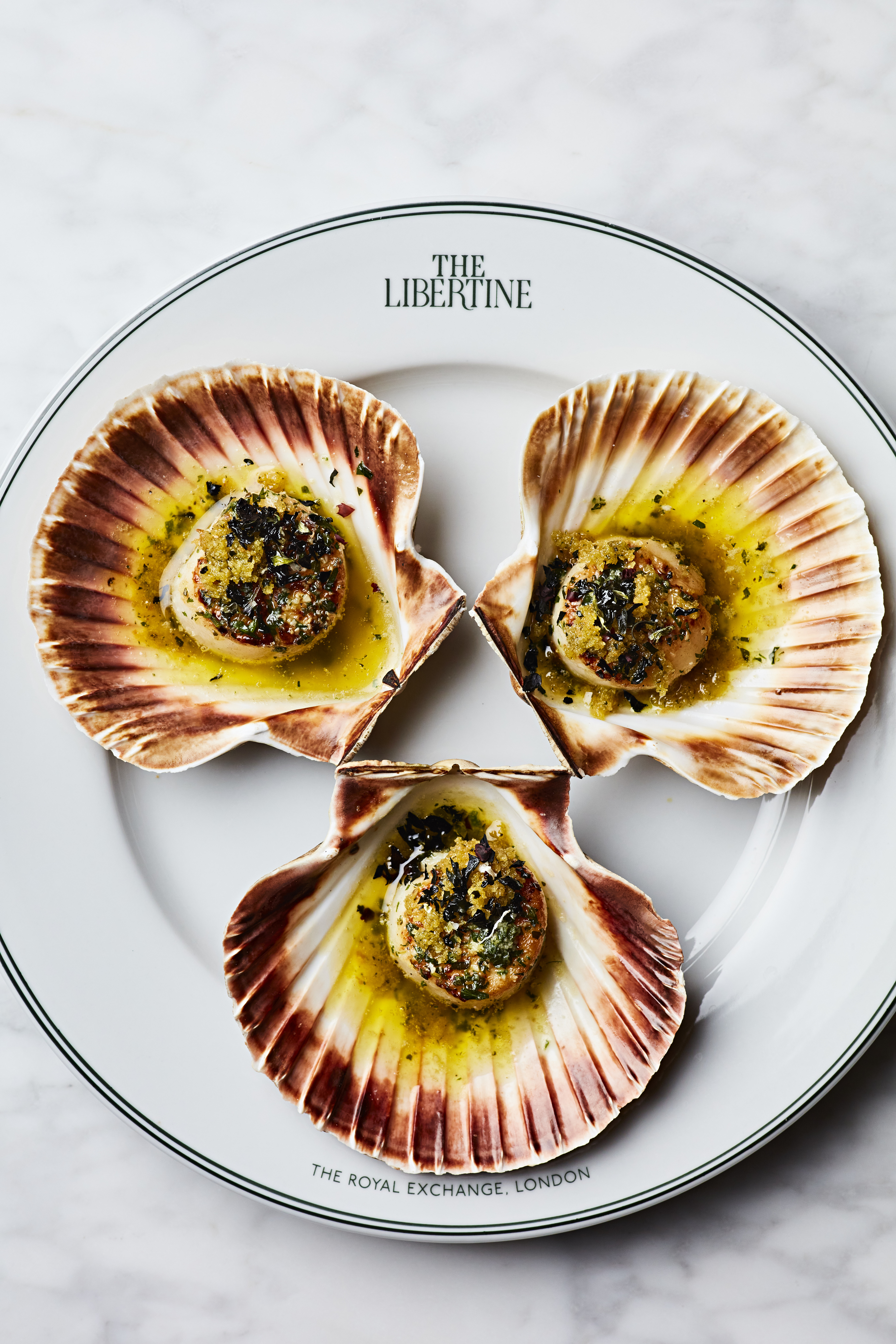 Scallops in shells at The Whiskey Vault, enhancing event dining experiences.