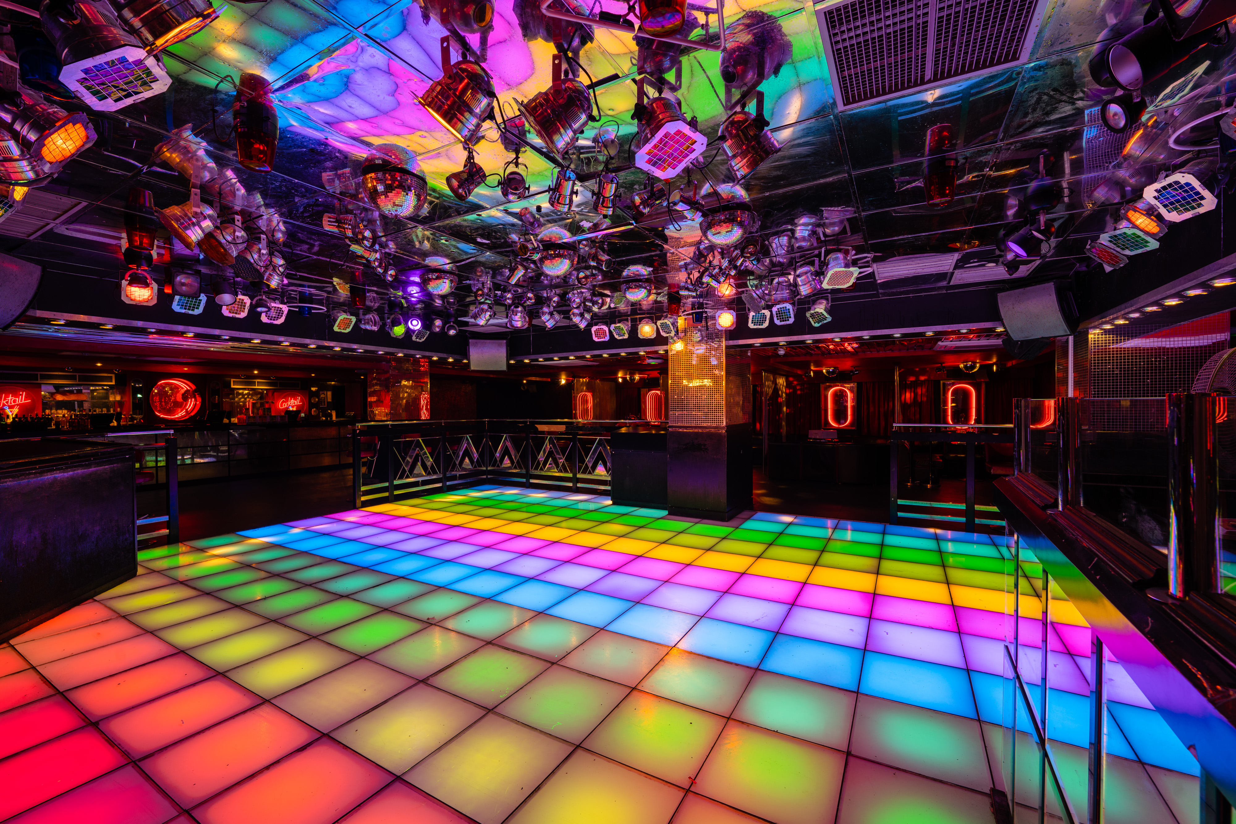 Vibrant Disco event space with LED dance floor, perfect for parties and corporate events.