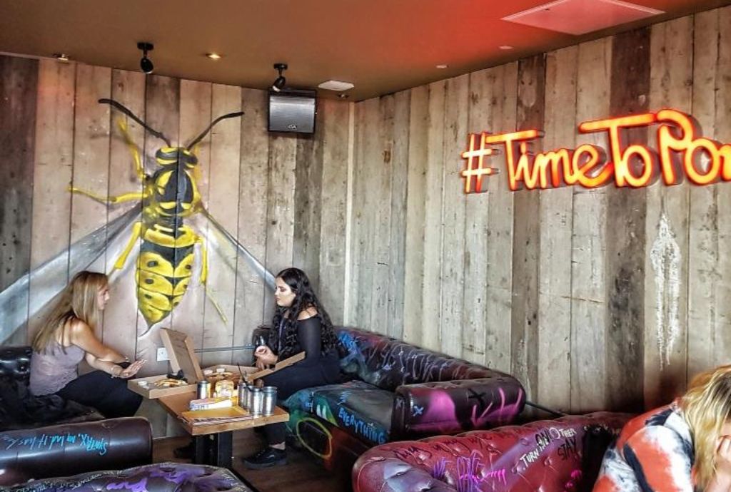 Steinbeck and Shaw in Pryzm Brighton, vibrant meeting space with bee mural, #TimeToParty.