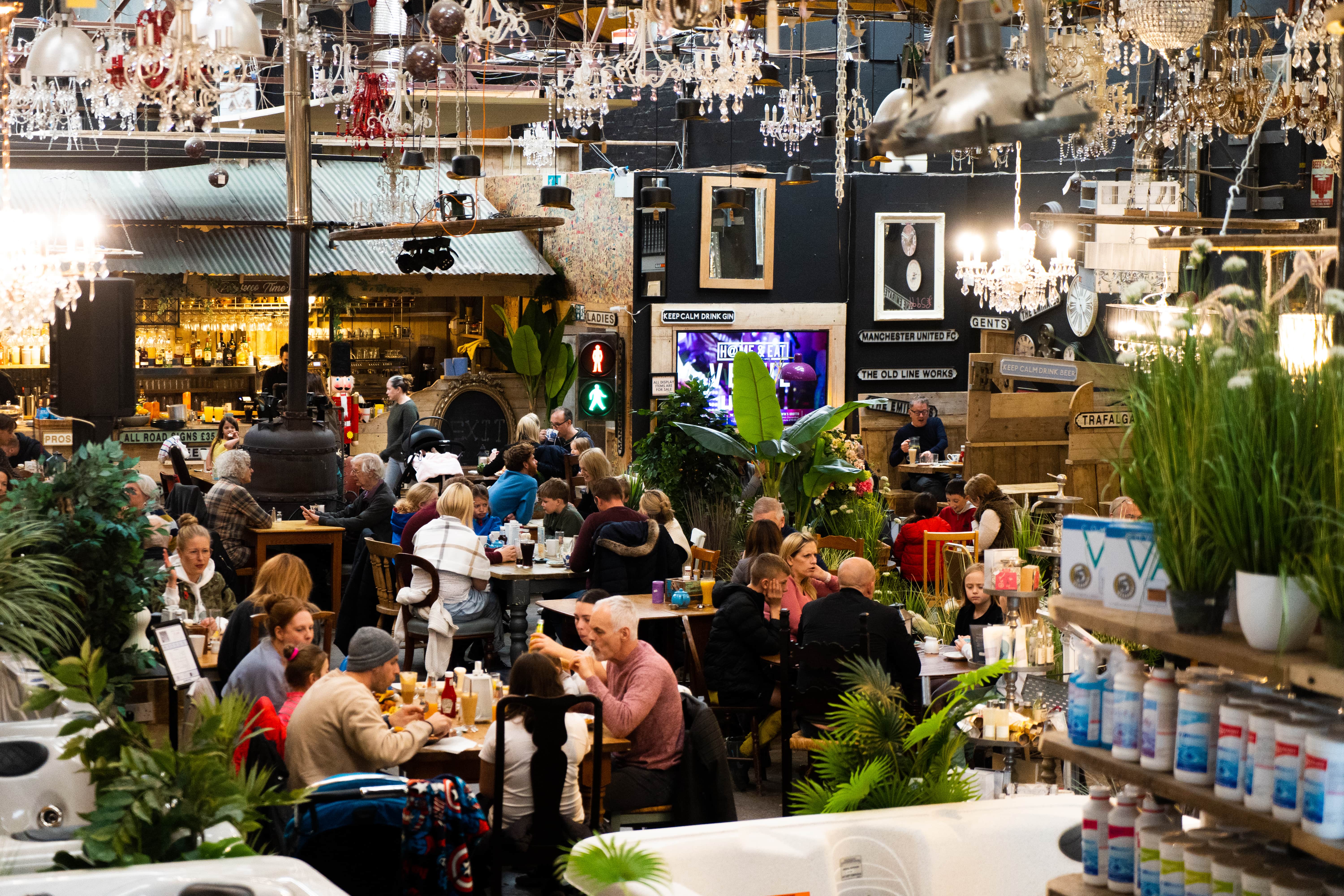 Vibrant event venue with chandeliers, ideal for gatherings and corporate functions.