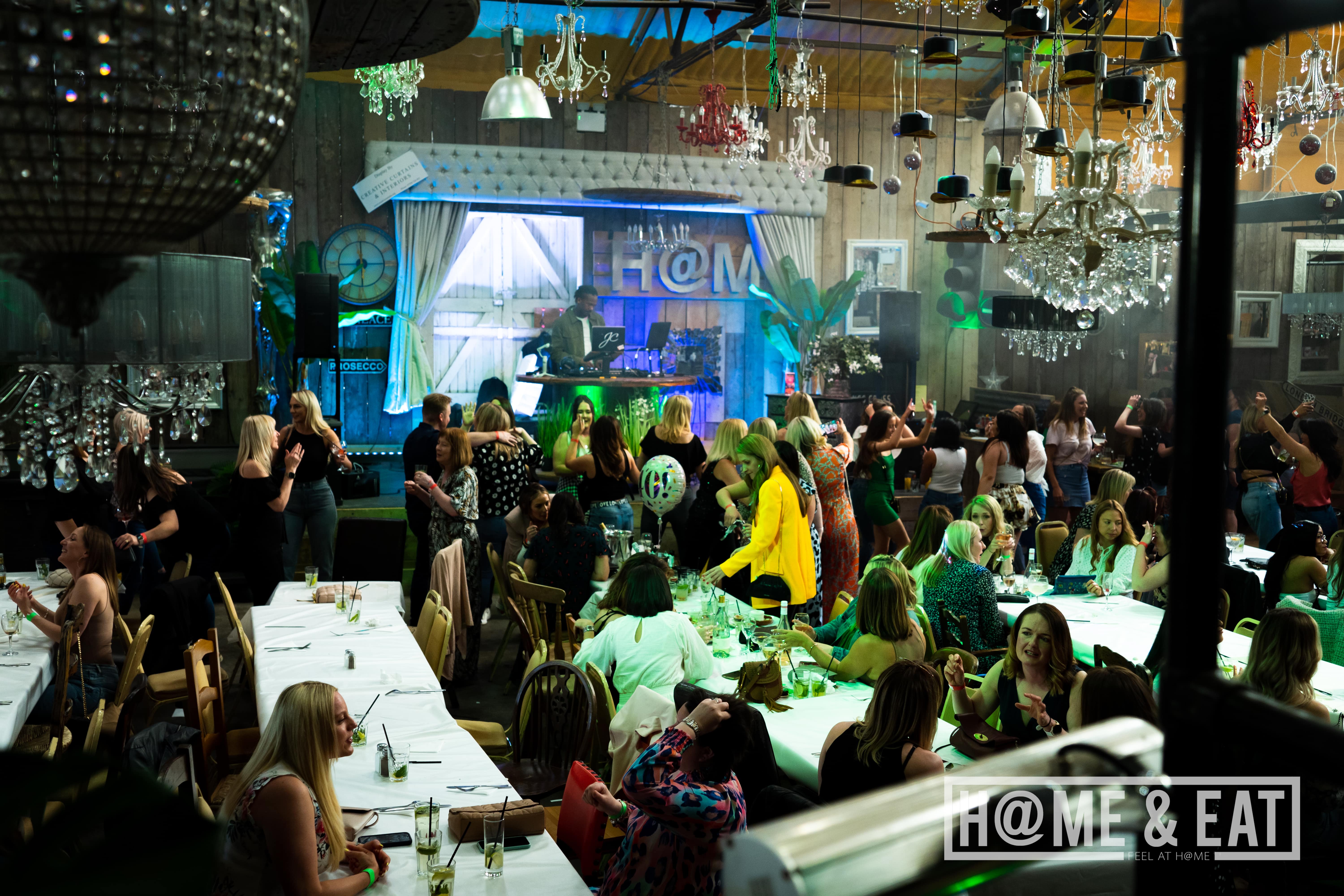Vibrant event space with elegant tables for networking and celebrations at H@ME & EAT.