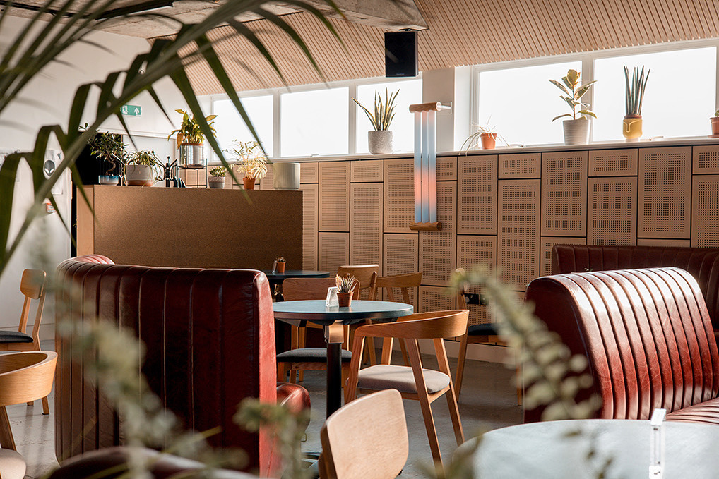 Modern venue with cozy booths, perfect for intimate meetings and events.