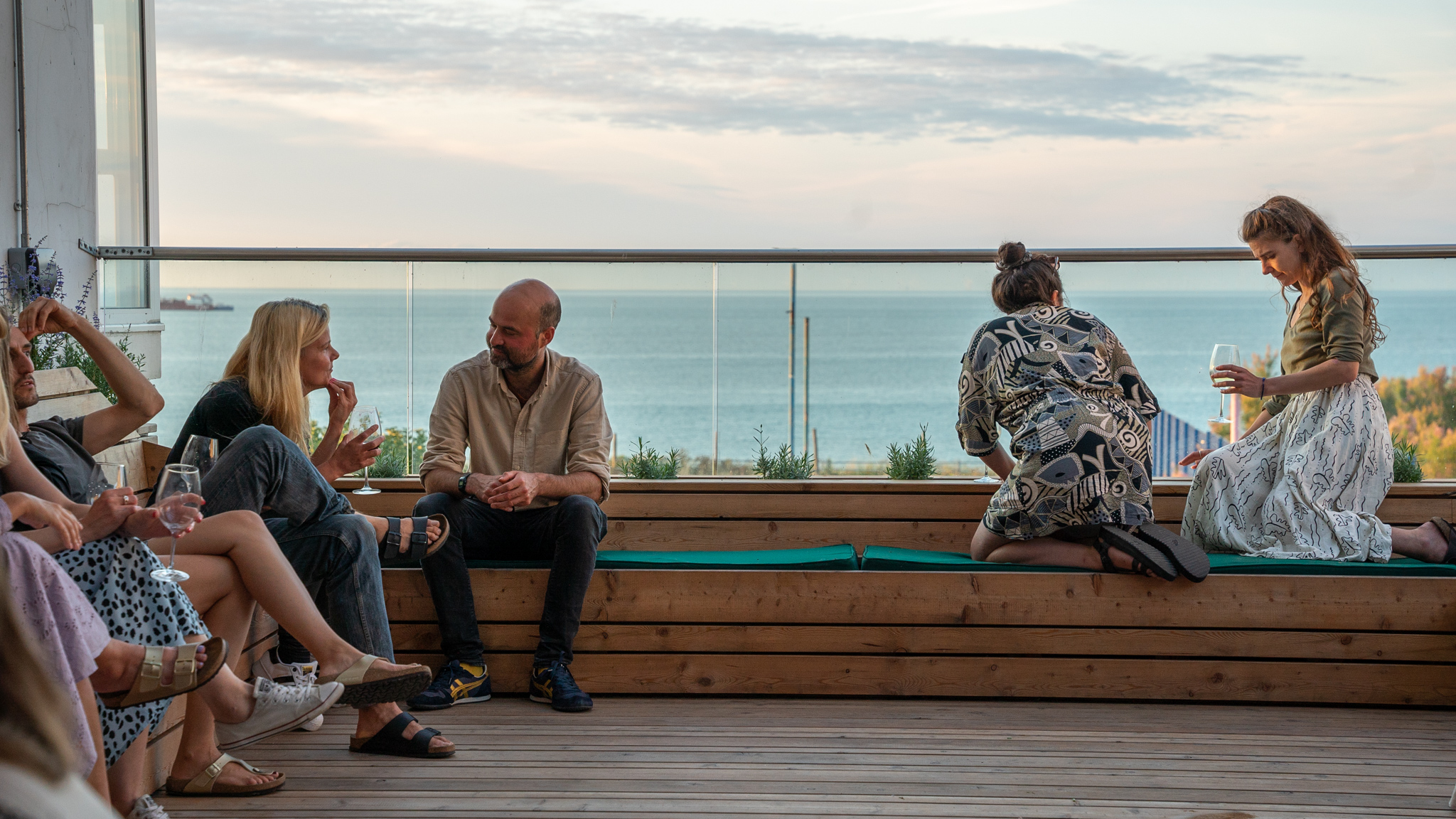 Outdoor networking venue with scenic water backdrop for casual meetings.