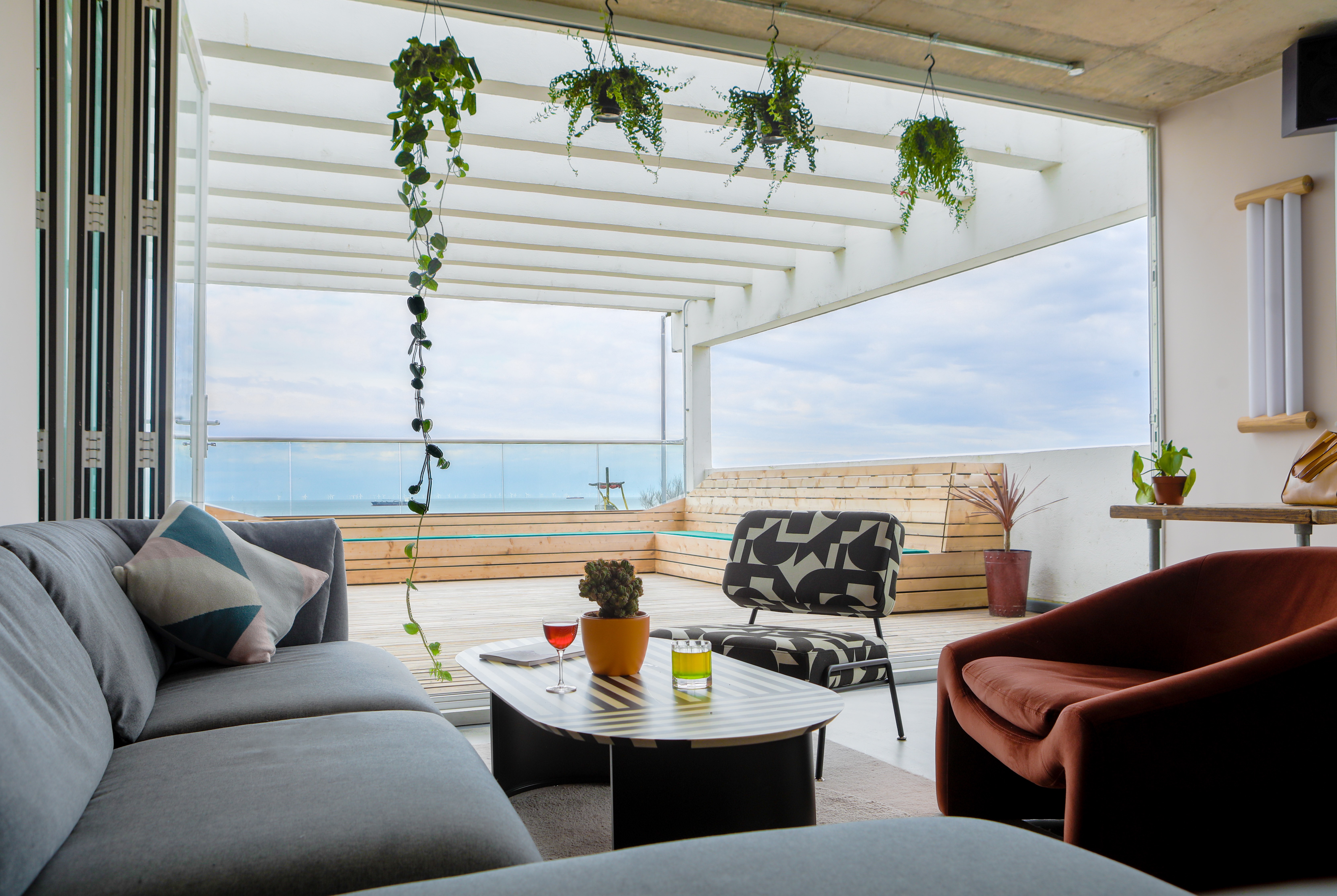 Modern lounge with water view, ideal for networking events and casual gatherings.