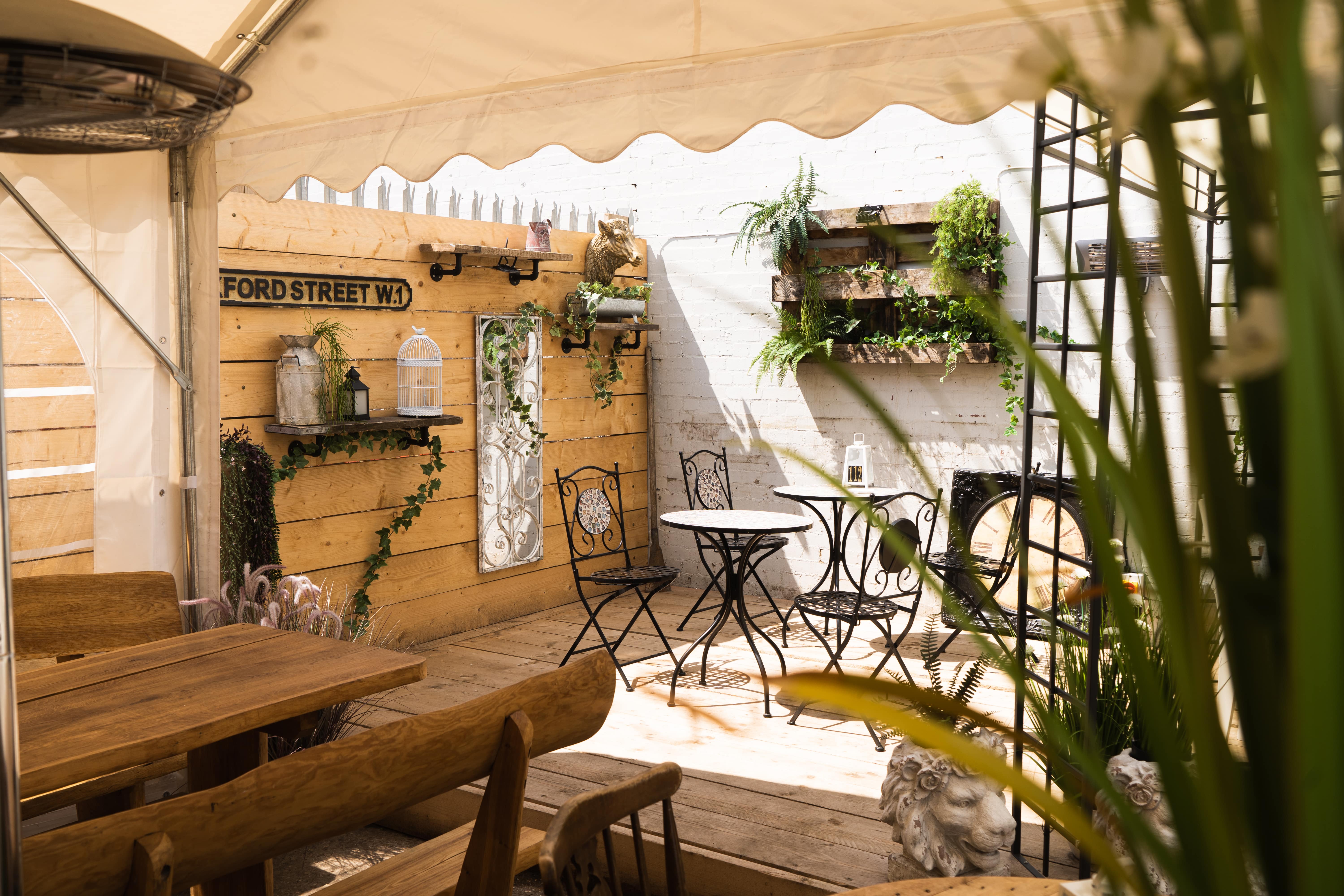 Charming outdoor meeting space with rustic decor for casual gatherings and workshops.