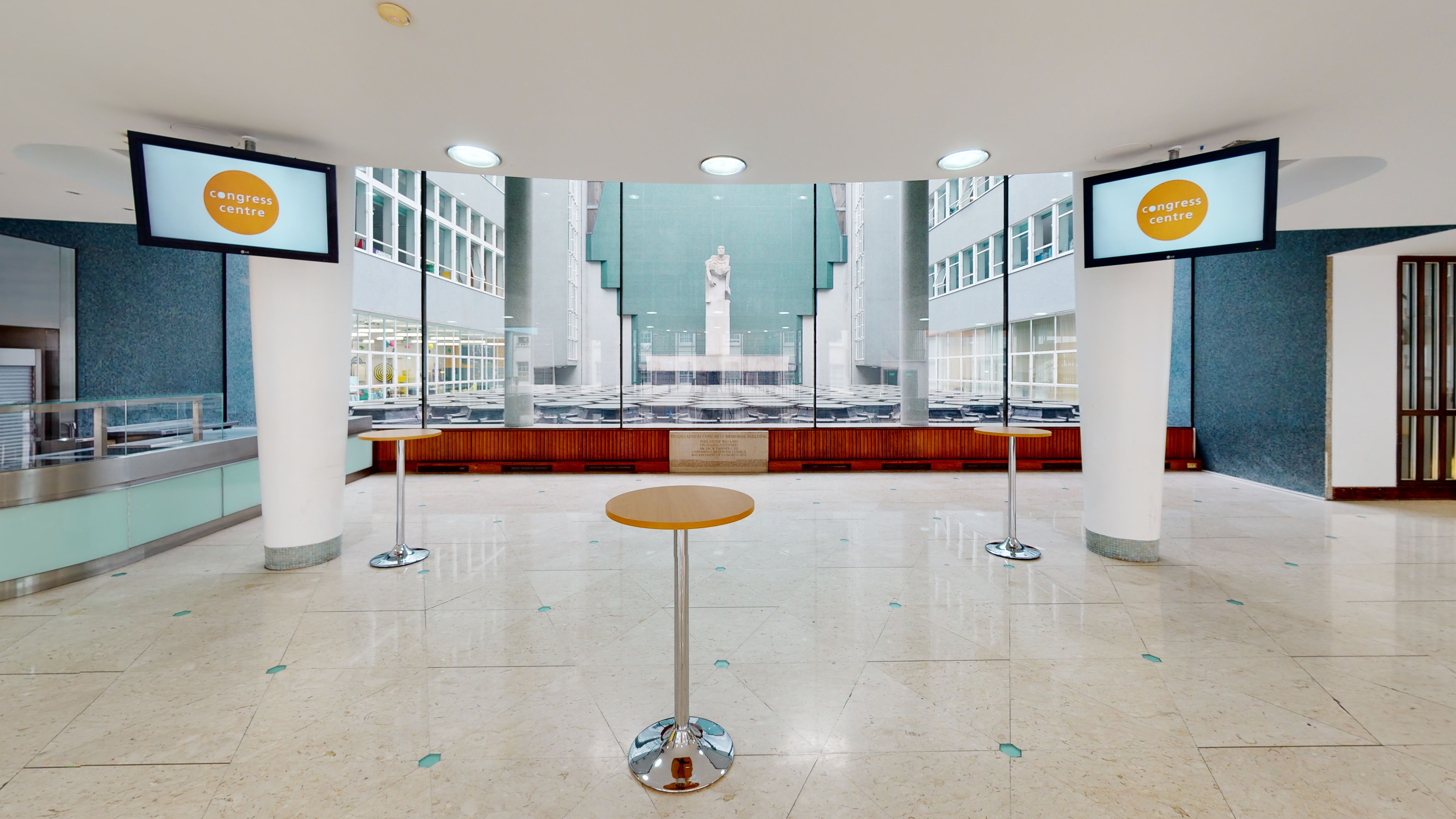 Marble Hall foyer with high ceilings, ideal for professional conference registration and networking.