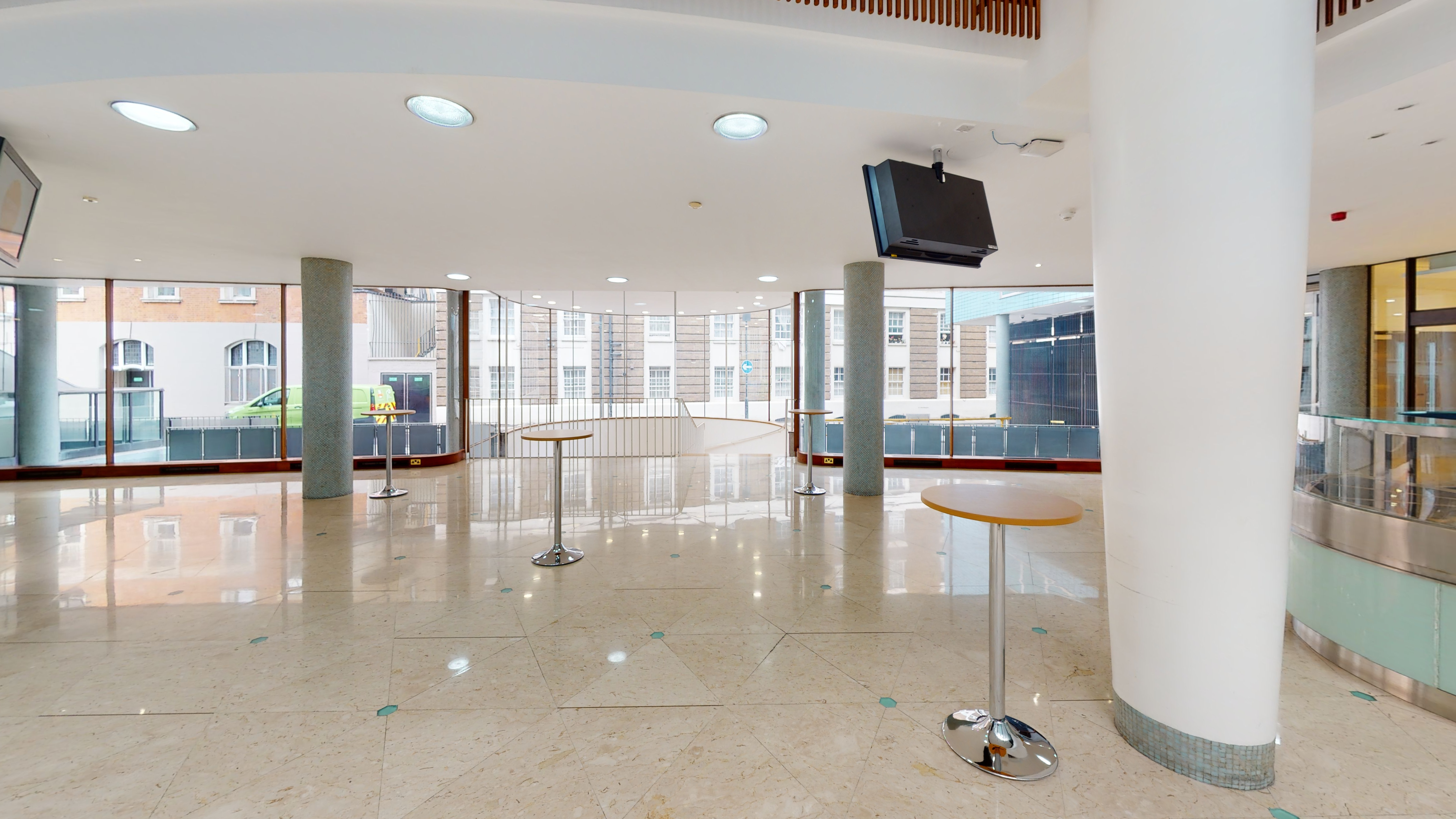 Marble Hall event space with natural light, ideal for corporate networking and registration.