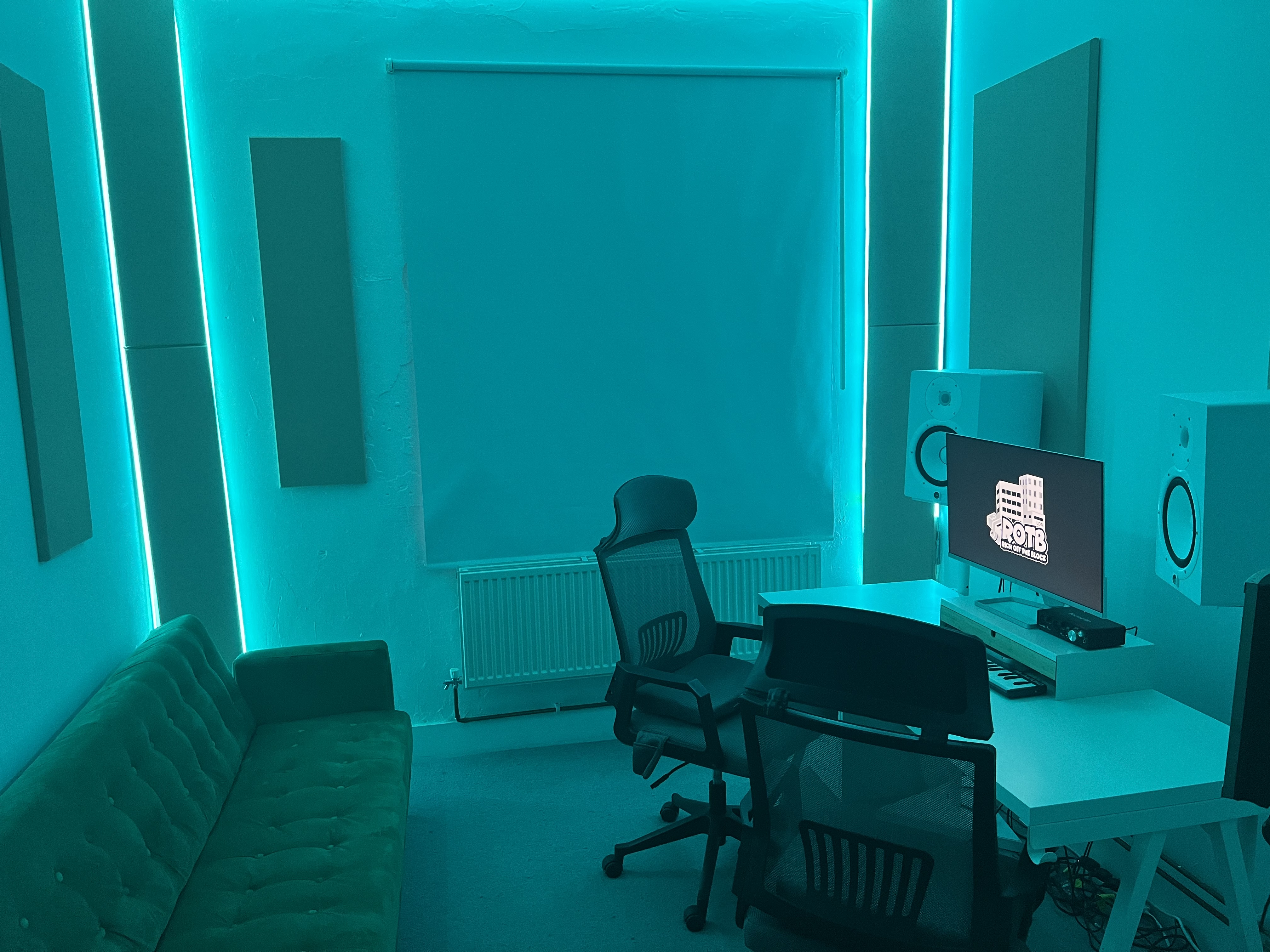 Modern music recording studio with ergonomic furniture for creative collaboration.