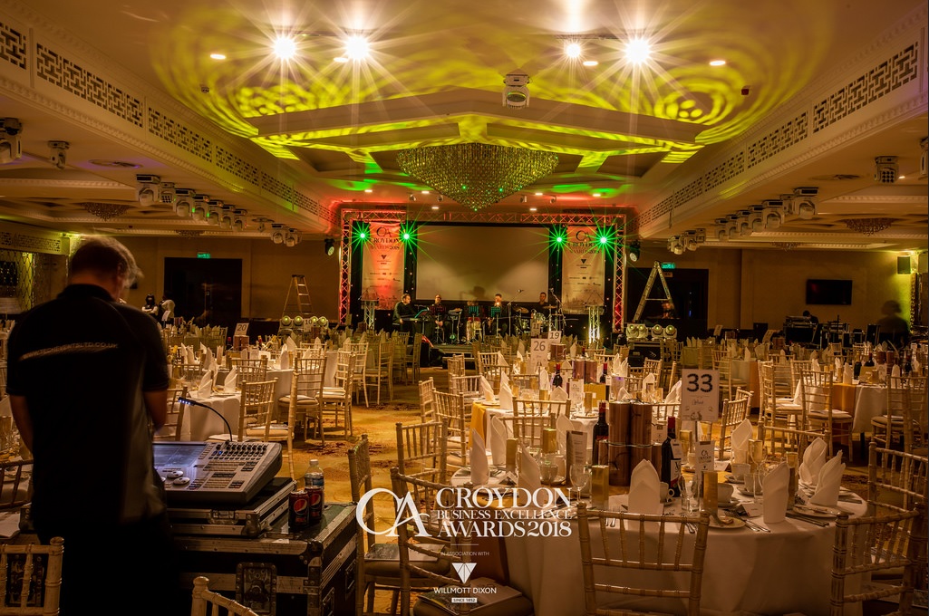 Elegant Grand Ballroom set for awards ceremony with ambient lighting and sophisticated decor.