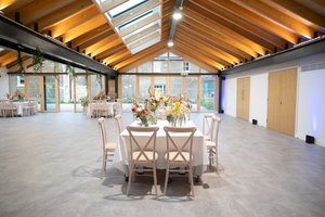 Orchard Room at The Glass House: elegant event space with wooden beams for weddings and meetings.