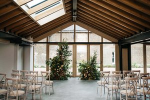 Orchard Room at The Glass House: elegant event space with wooden beams for weddings and workshops.