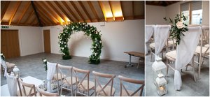 Sky Room at The Glass House: elegant wedding venue with floral arch and inviting atmosphere.
