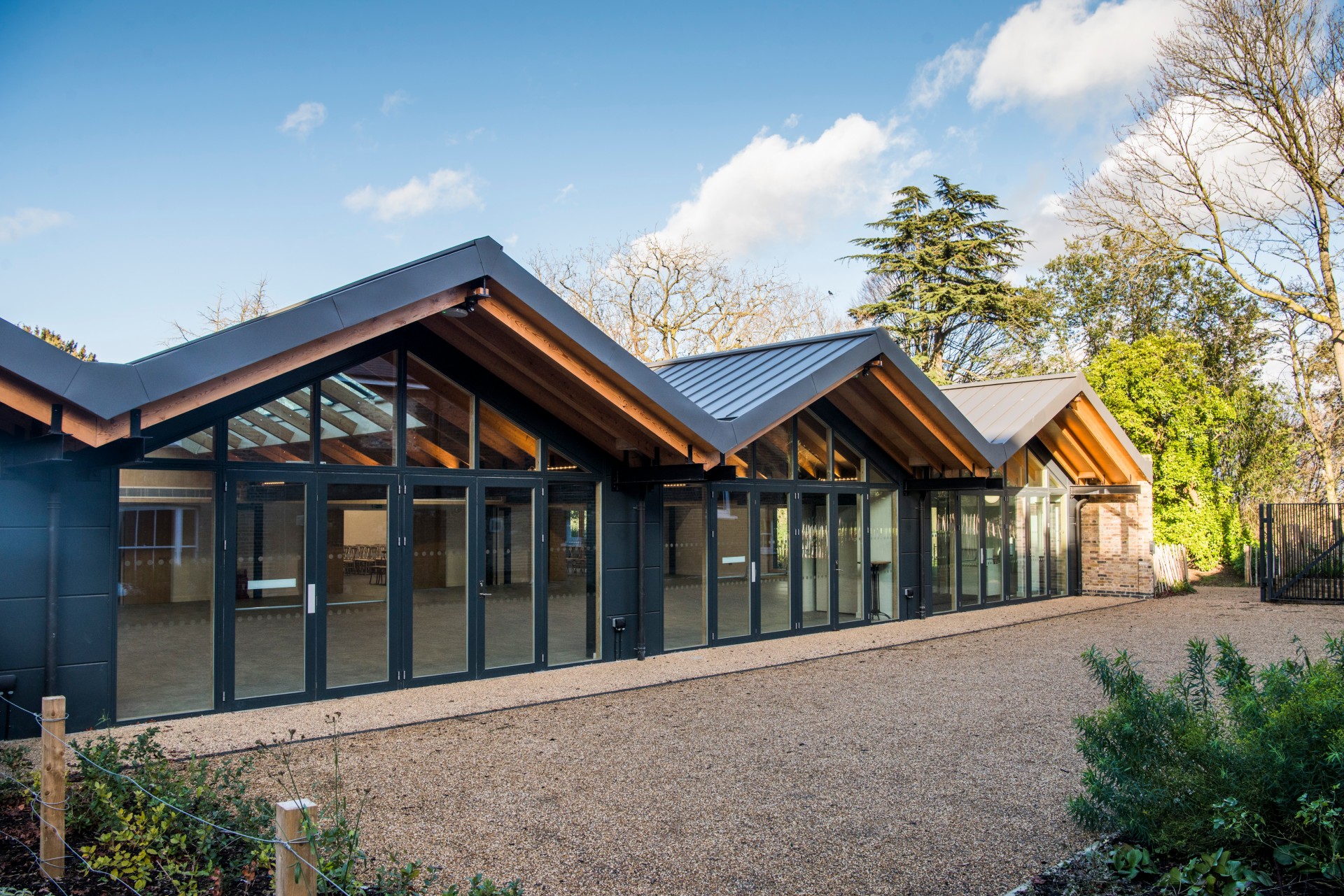 Modern event venue with large glass windows, ideal for corporate meetings and social events.