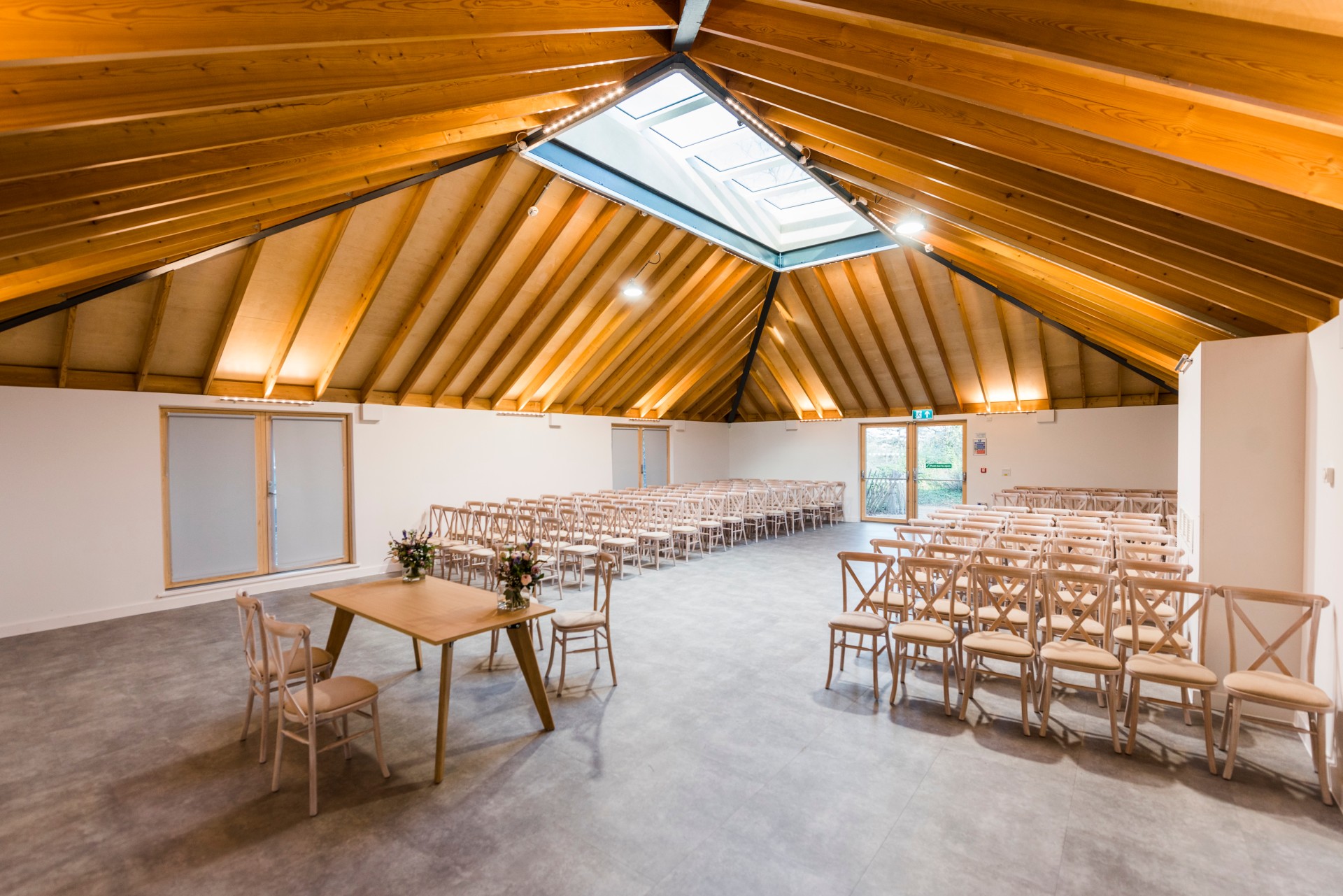 Versatile event space in The Glass House with high wooden ceiling for presentations and workshops.
