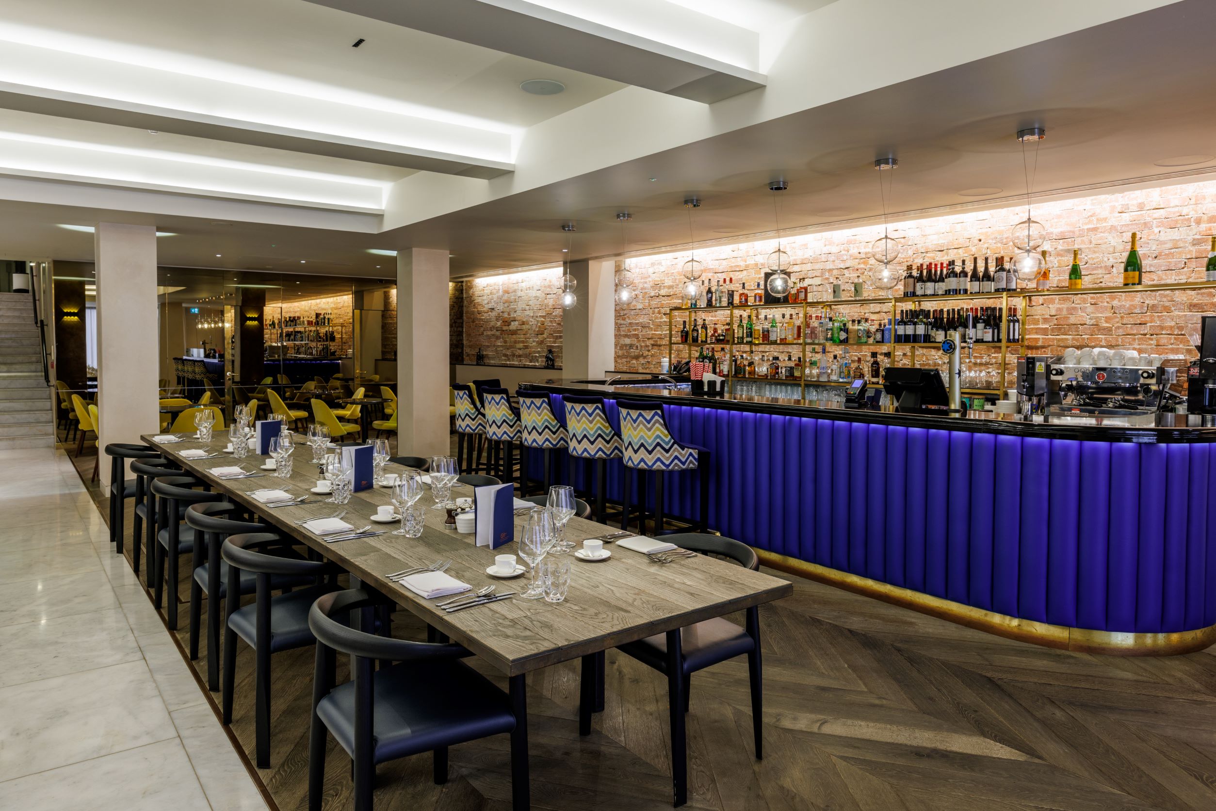 Modern restaurant at One Moorgate Place with sleek bar, ideal for events and gatherings.