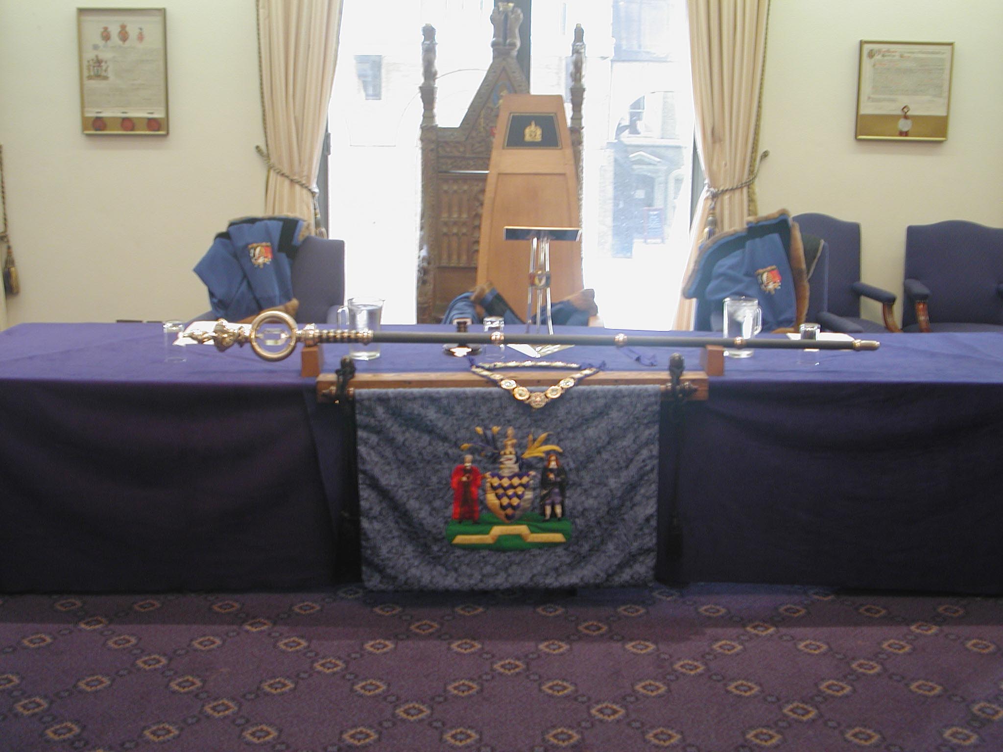 Formal meeting setup in Glaziers Hall with blue table, ideal for governance events.