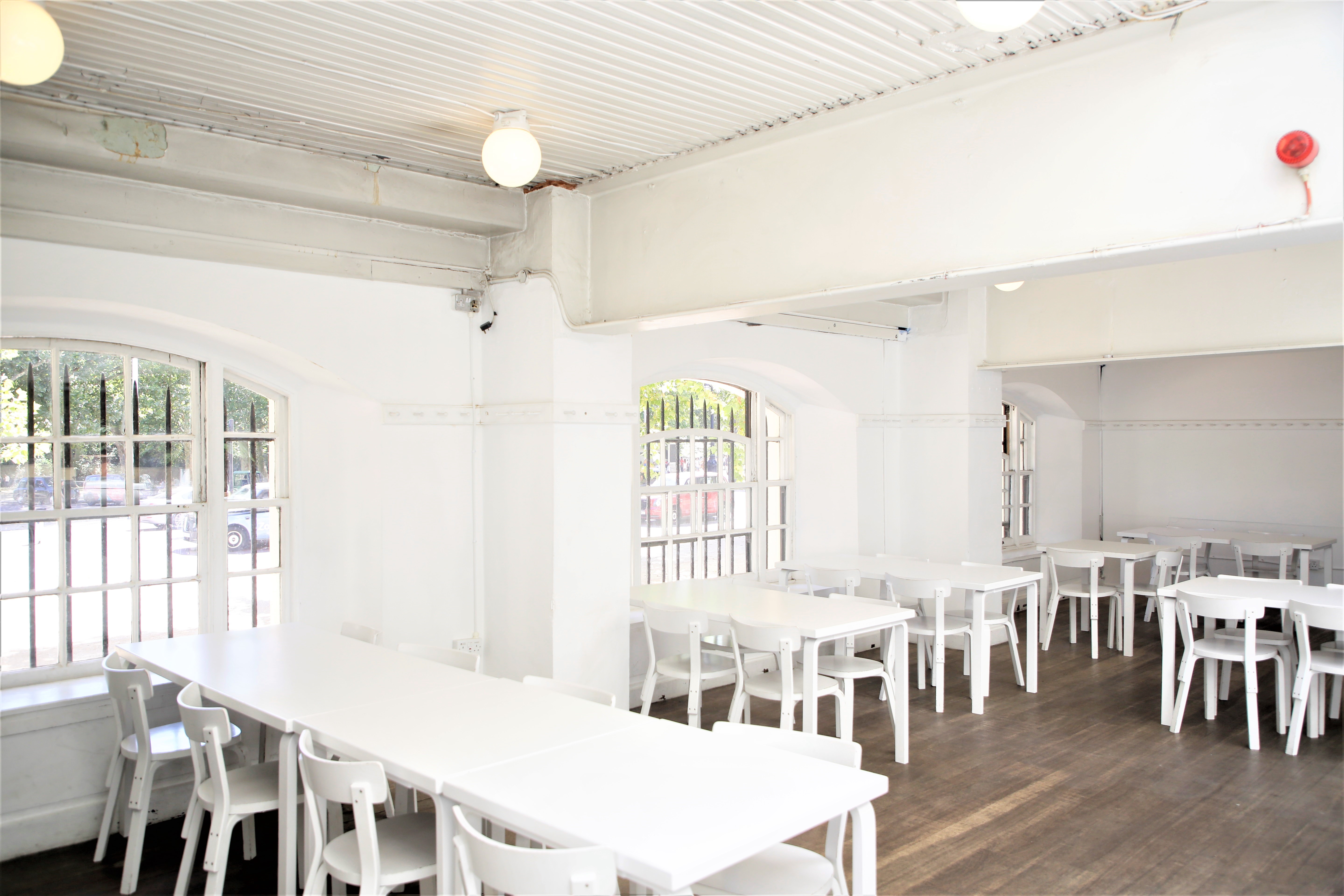 Bright minimalist ICA Bar event space with natural light, perfect for meetings and workshops.