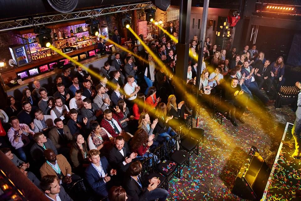 Vibrant event space at Egg LDN with engaged audience, ideal for networking and entertainment.