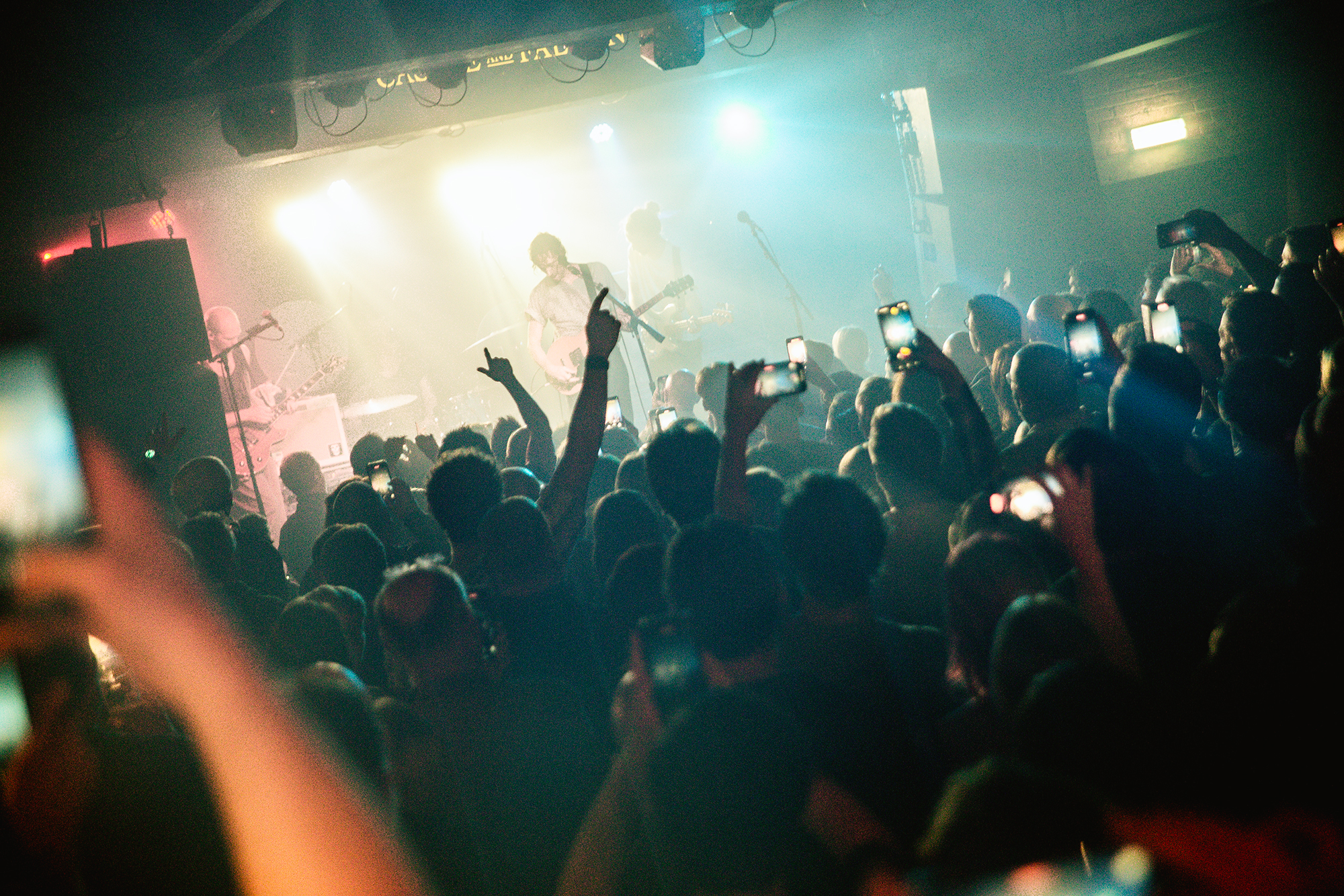 Vibrant live music event at Castle & Falcon with engaged audience and dynamic lighting.