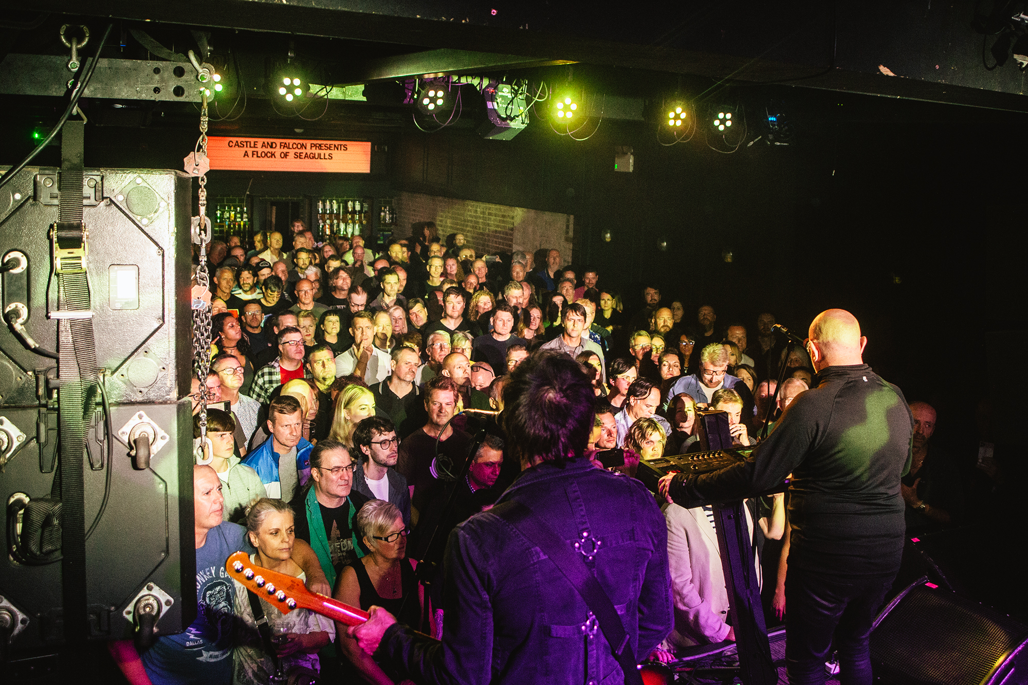 Packed live music venue at Castle & Falcon showcasing audience engagement and atmosphere.