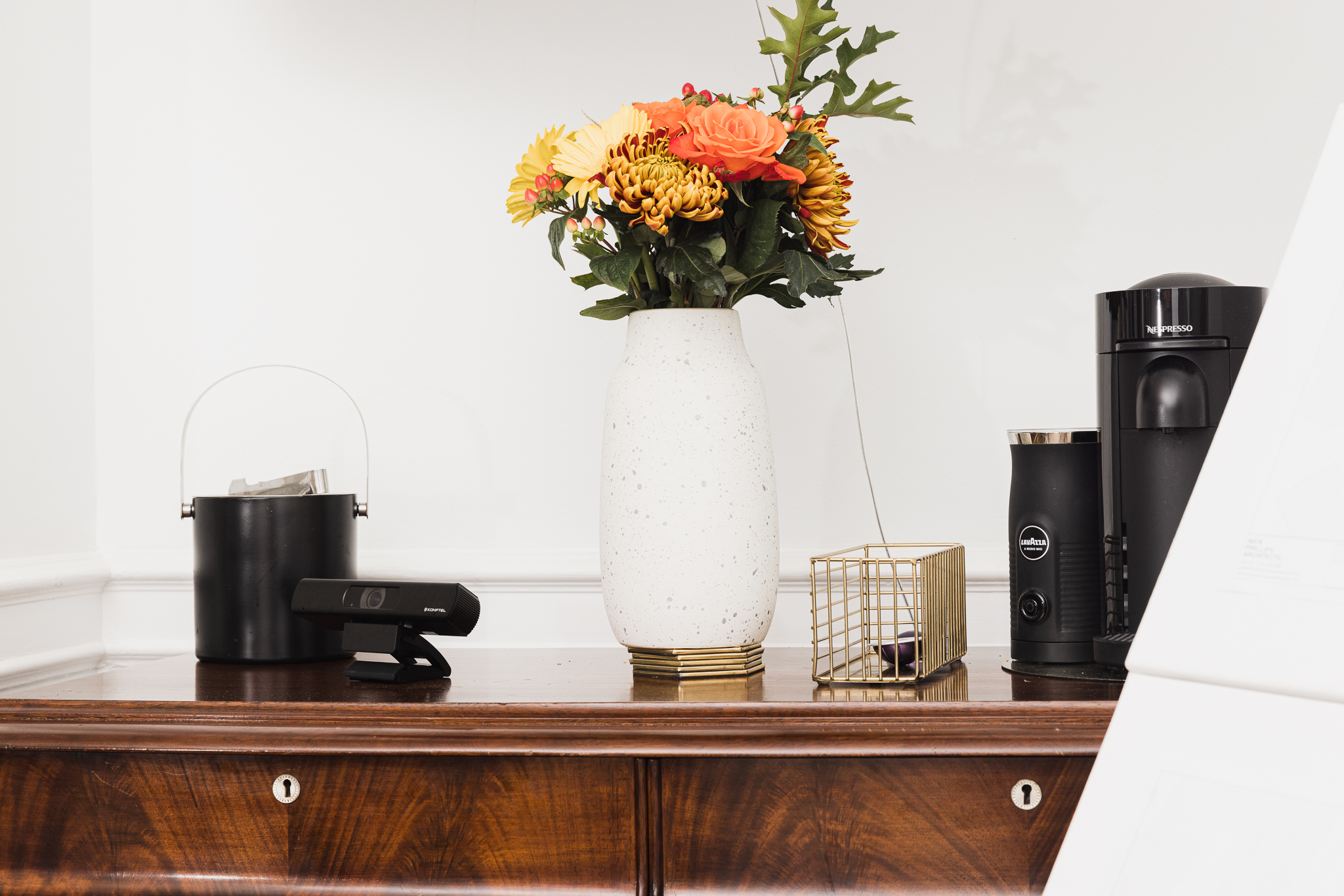Elegant refreshment station with flowers at The Boardroom, ideal for corporate events.