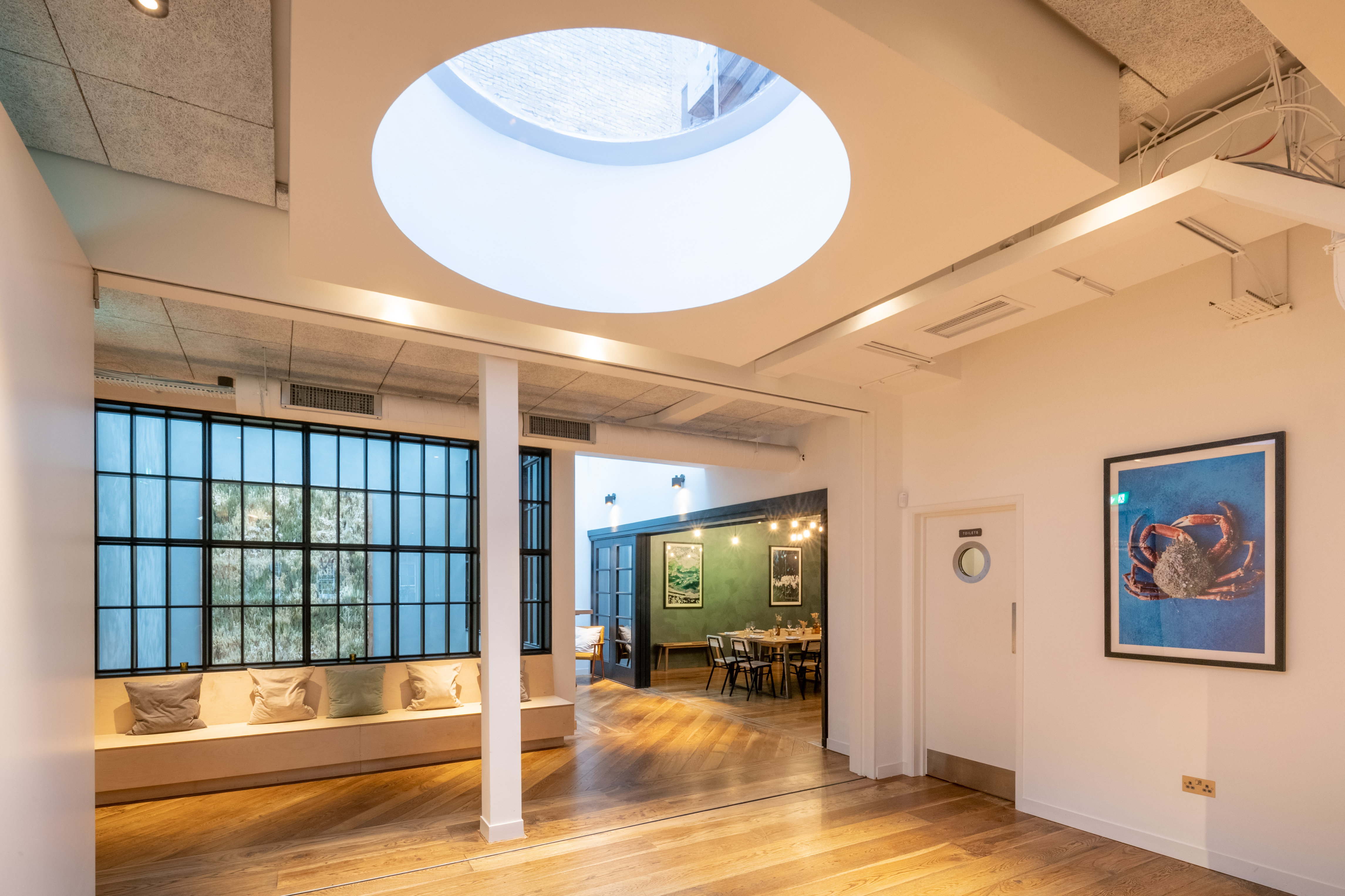 Modern event space in Carousel London with skylight, perfect for meetings and receptions.