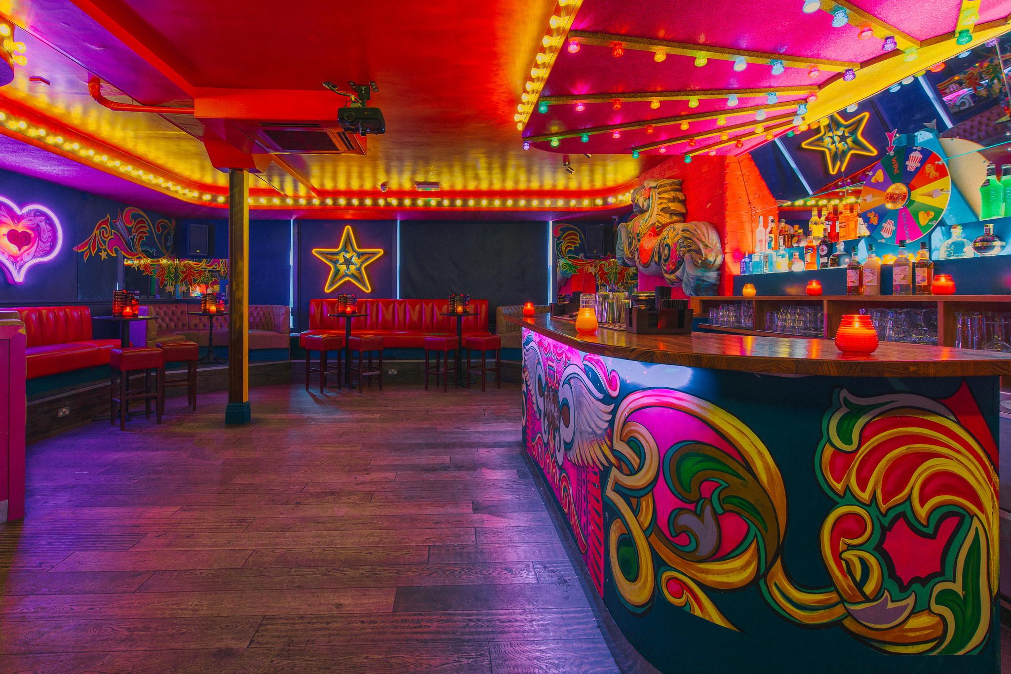 Vibrant Fairground 1 venue with neon lights for creative gatherings and parties.