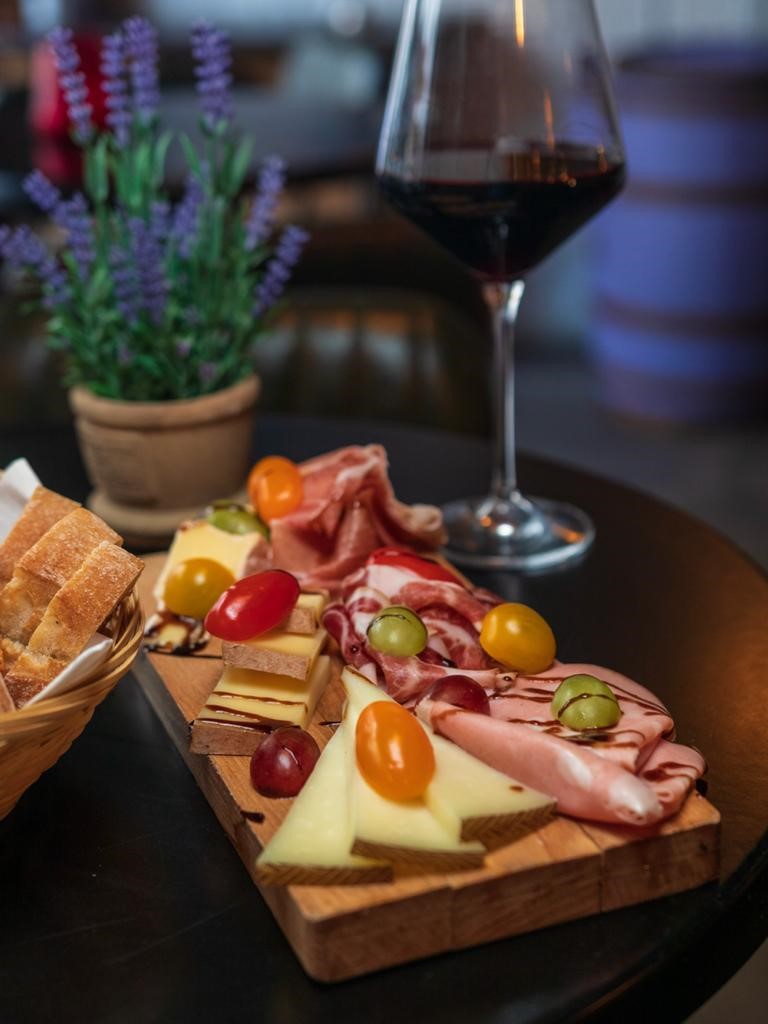 Elegant charcuterie board with wine at Cecilia's Wine House for upscale events.
