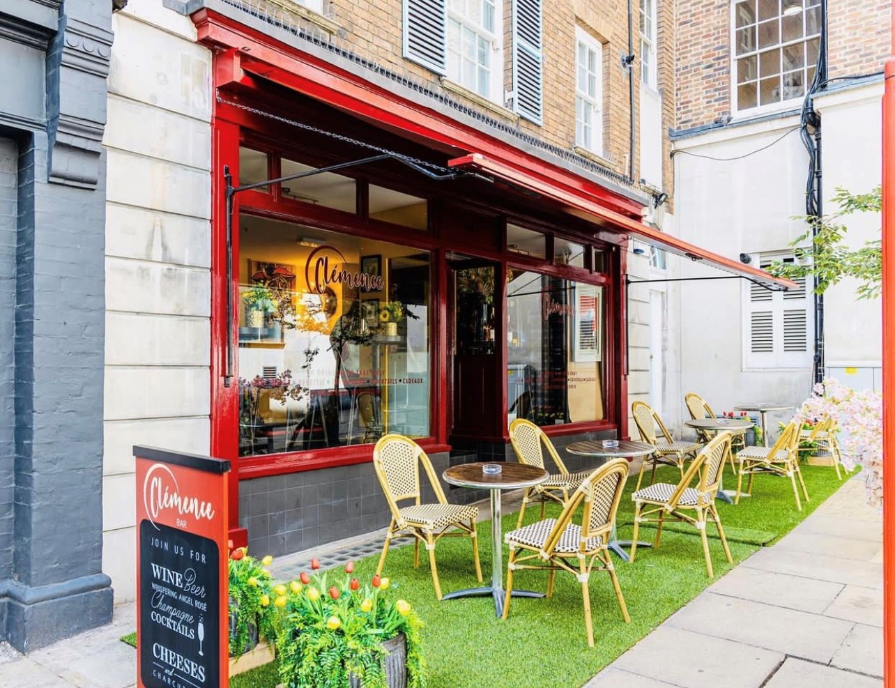 Charming café venue with outdoor seating, perfect for casual meetings and networking events.
