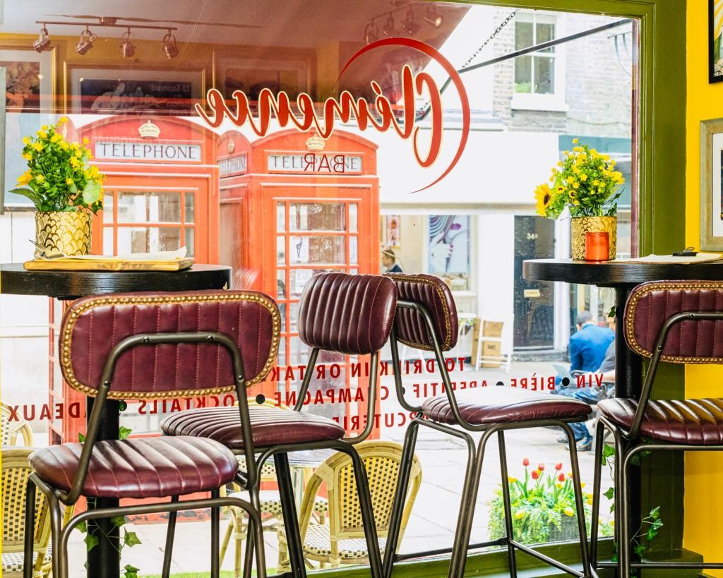 Vibrant Clemence Bar venue with high-top tables, perfect for networking events.