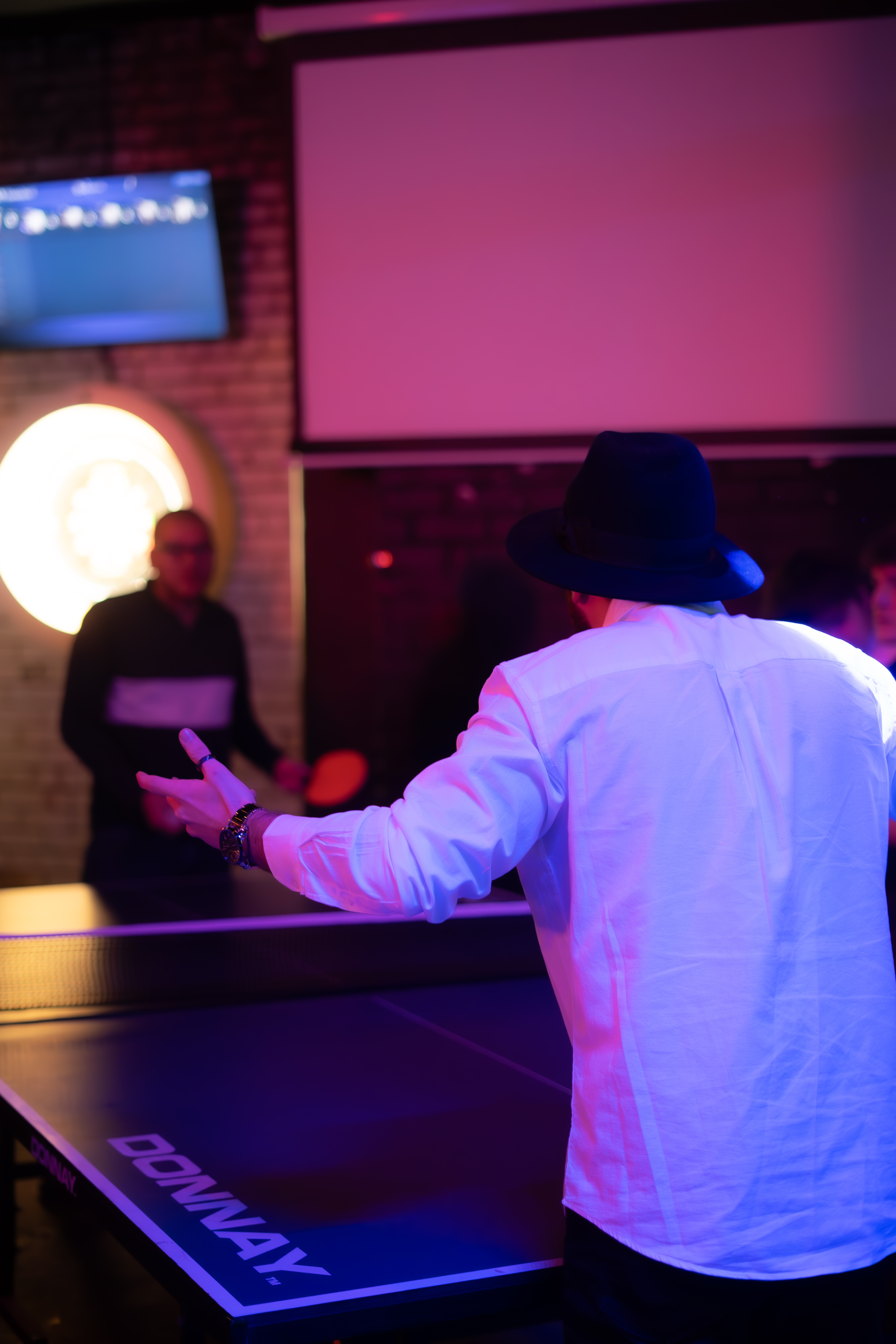 Dynamic social event at The Lost Weekend, modern vibe, networking and team-building.