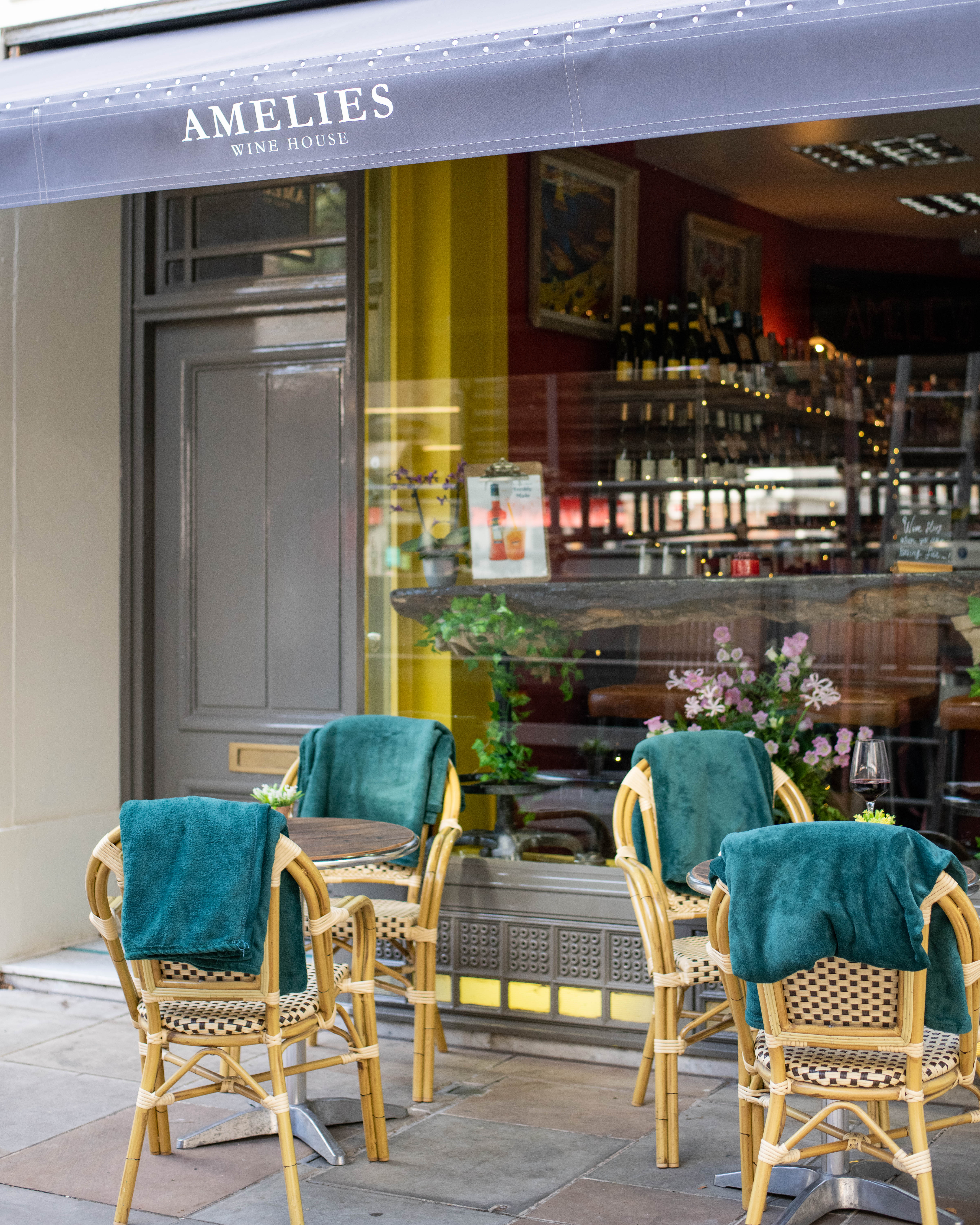 Outdoor seating at Amelie's Wine House, perfect for casual meetings and networking events.