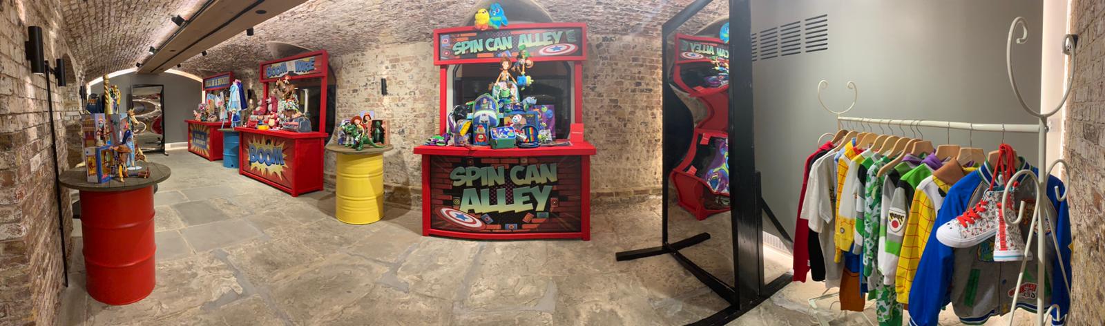 London Bridge Arches event space with colorful "Spin Can Alley" game booth for networking.