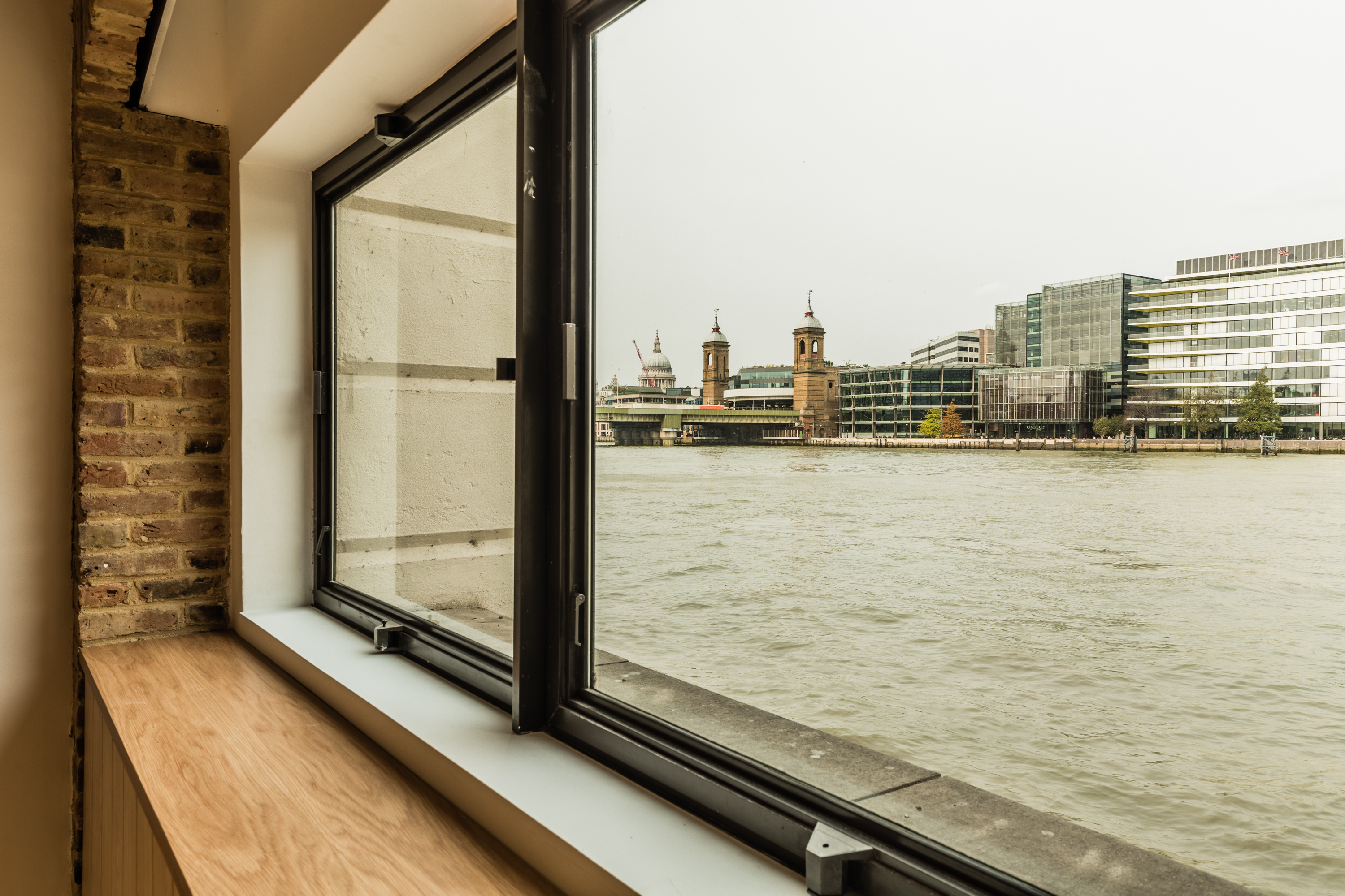 Thames Room at Glaziers Hall with riverside view, perfect for creative events.
