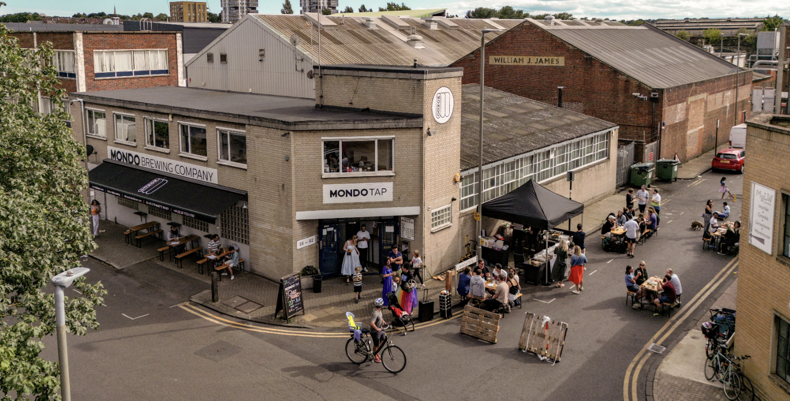 Vibrant indoor-outdoor venue at Mondo Brewing for events and gatherings.