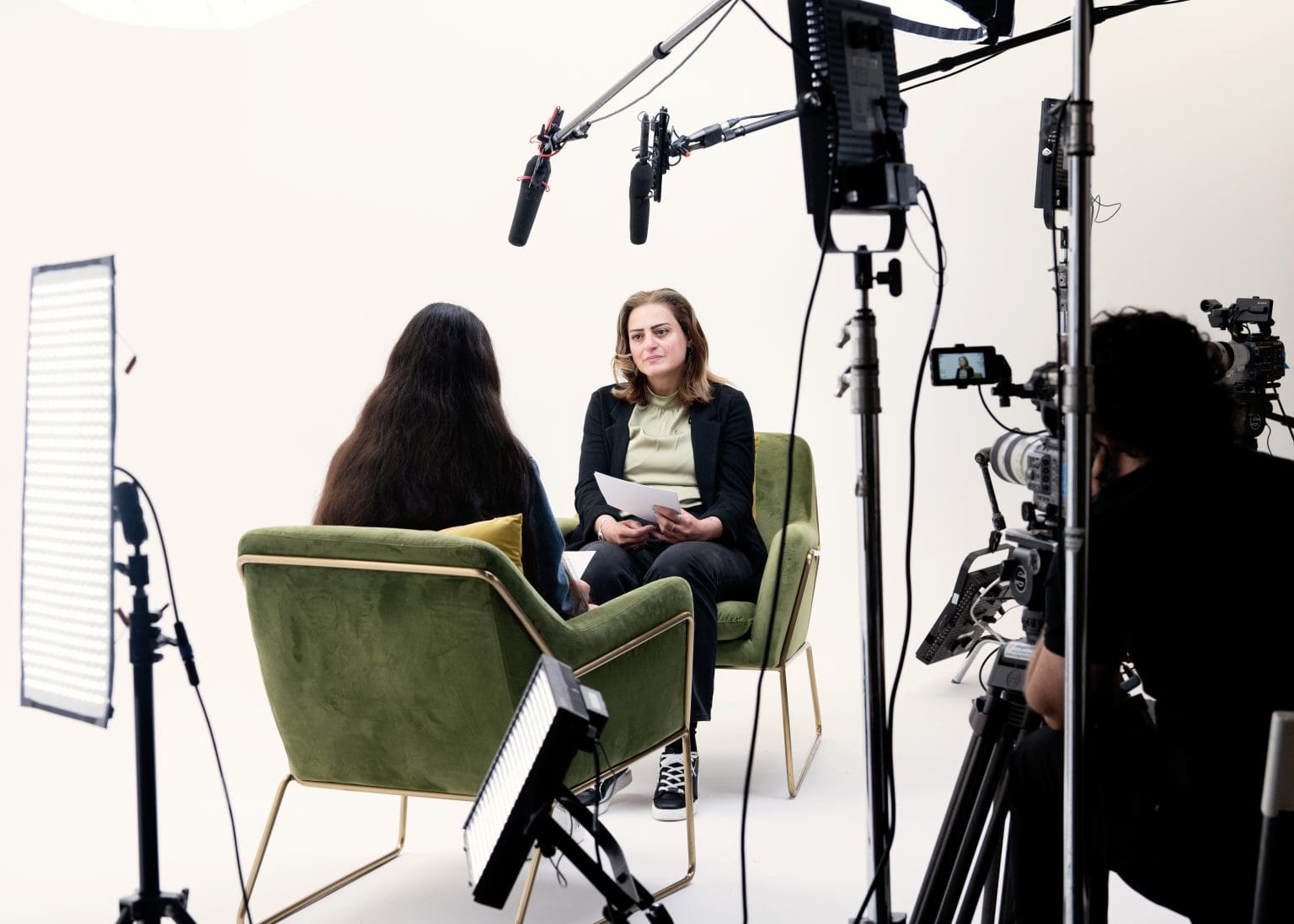 Professional interview setup at Infinity Cove Film with stylish chairs and cameras.