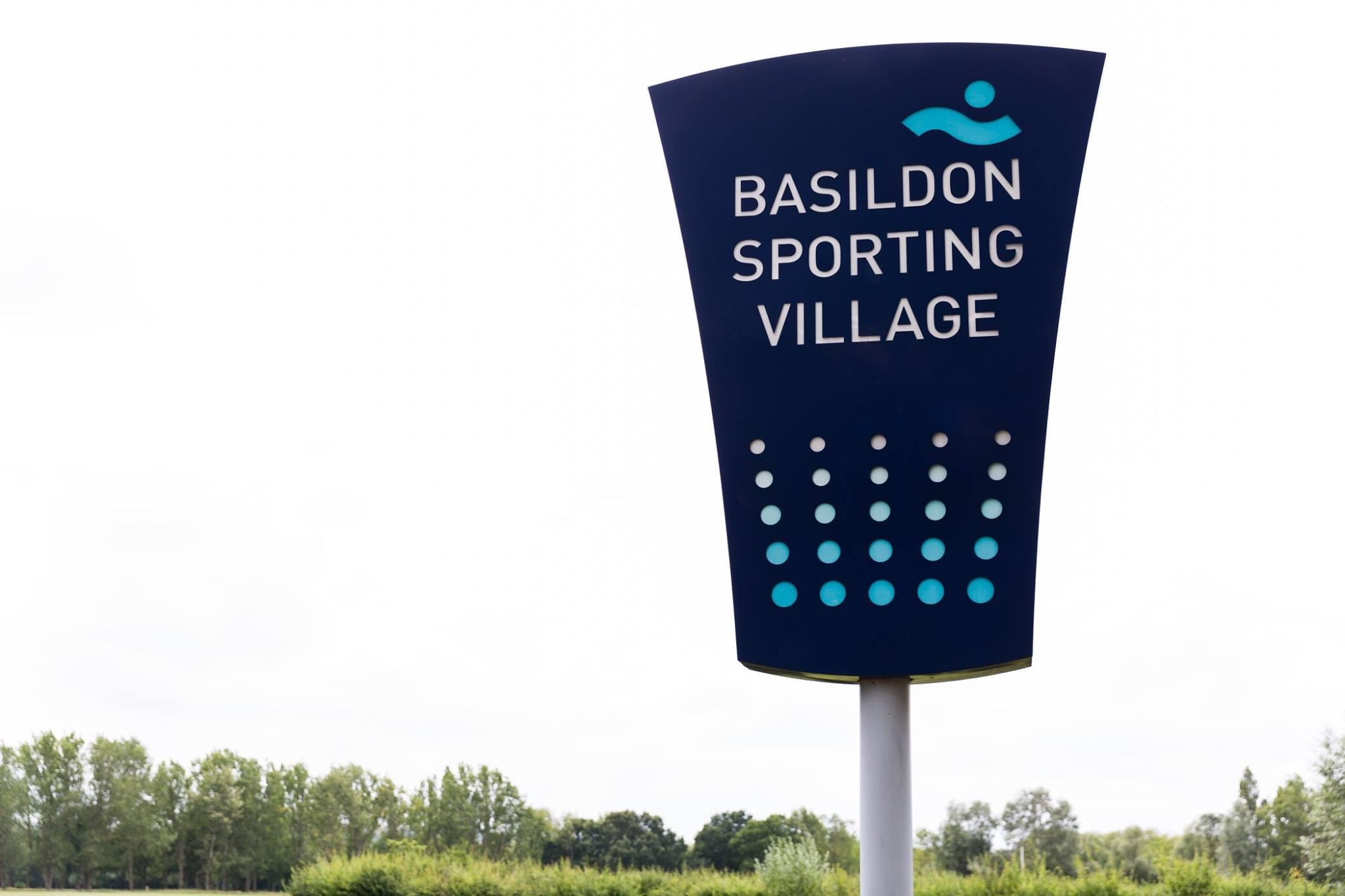 Basildon Sporting Village sign, modern venue for sports events and conferences.