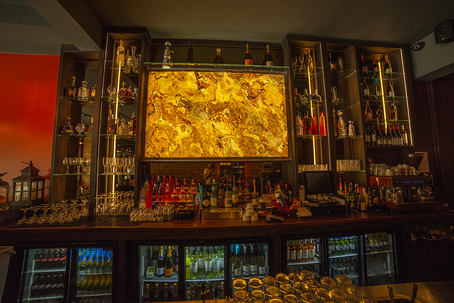 Well-stocked BAR 8 with elegant lighting, perfect for networking events and cocktail receptions.