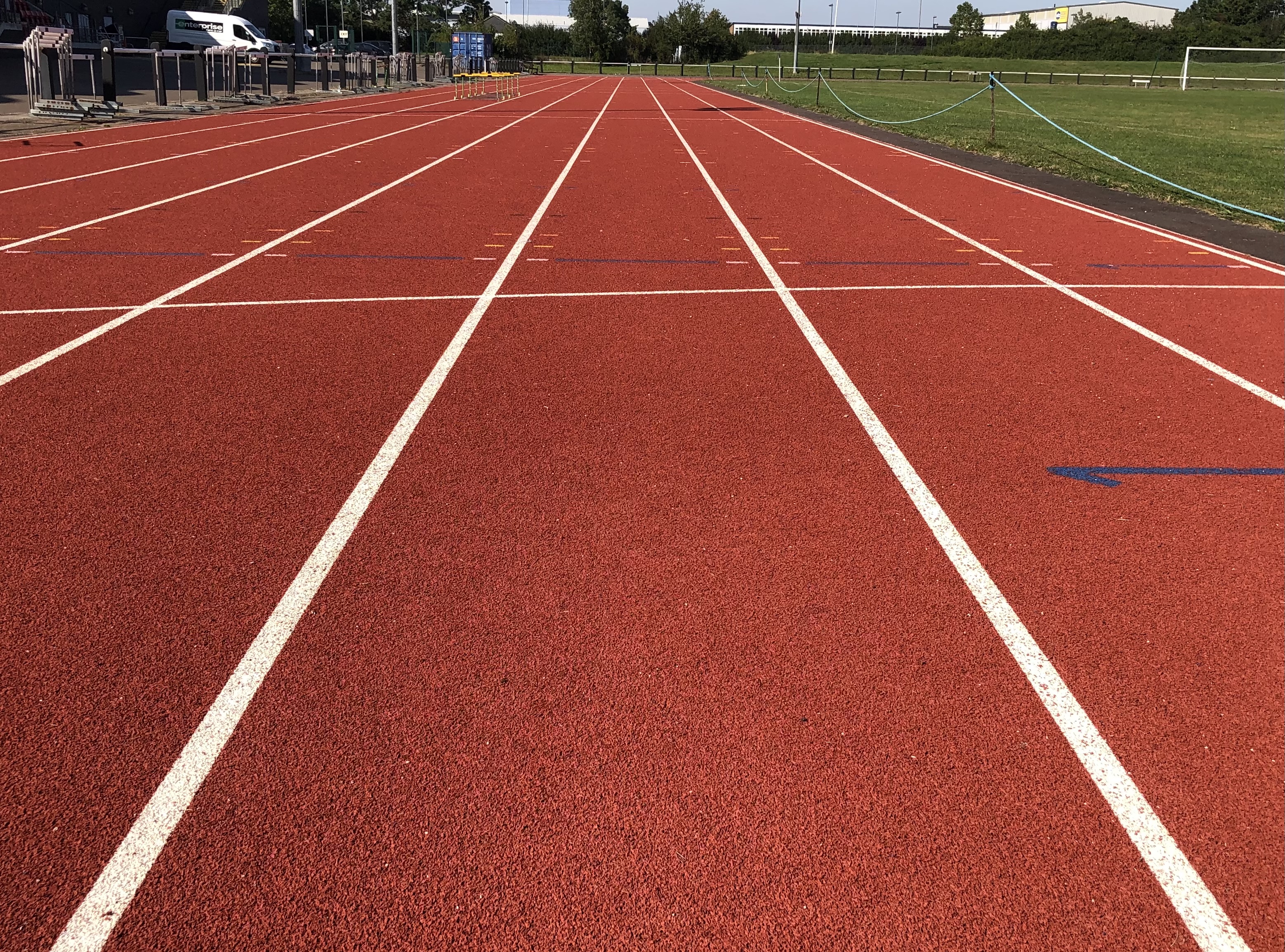 Athletics track in Basildon, vibrant surface for competitive events and team-building.
